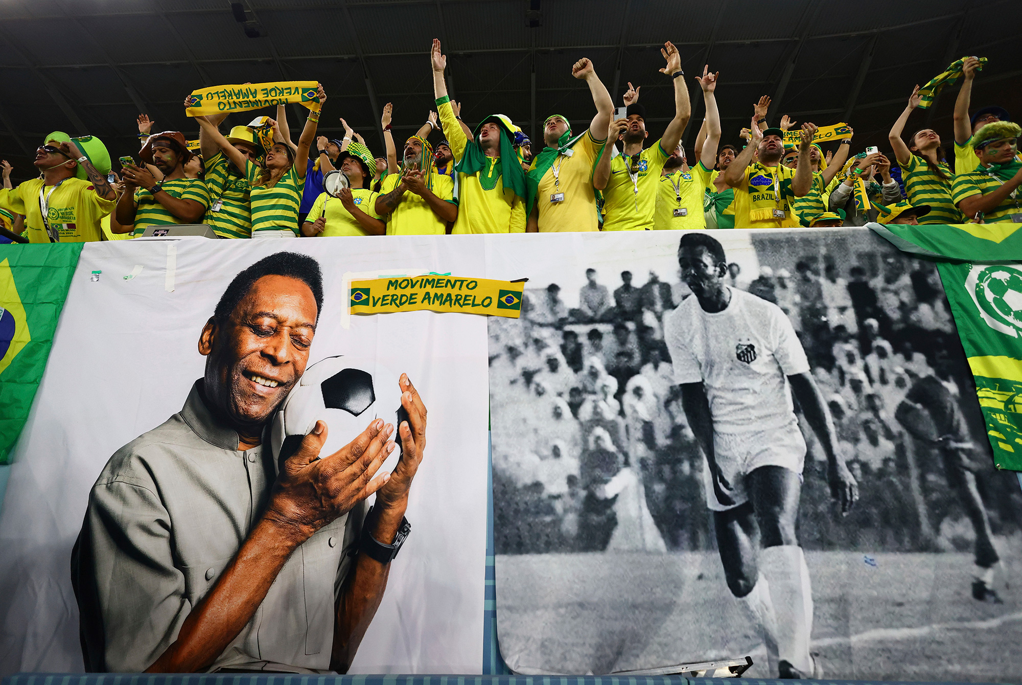 Brazil fans with a banner depicting Pelé before the Brazil vs South Korea match.