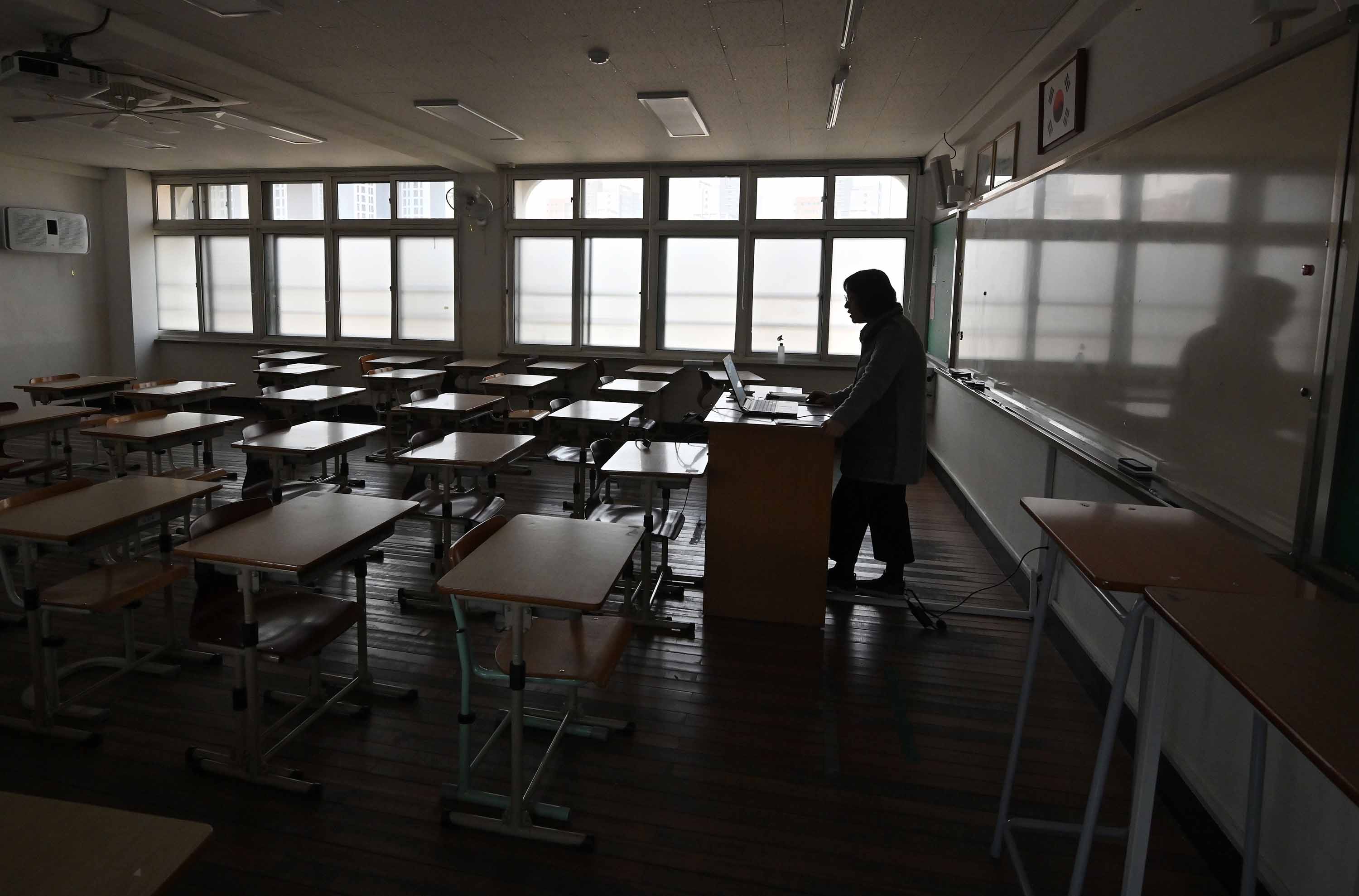 A teacher gives an online class lecture at Seoul Girls' High School in Seoul, South Korea, on April 9.