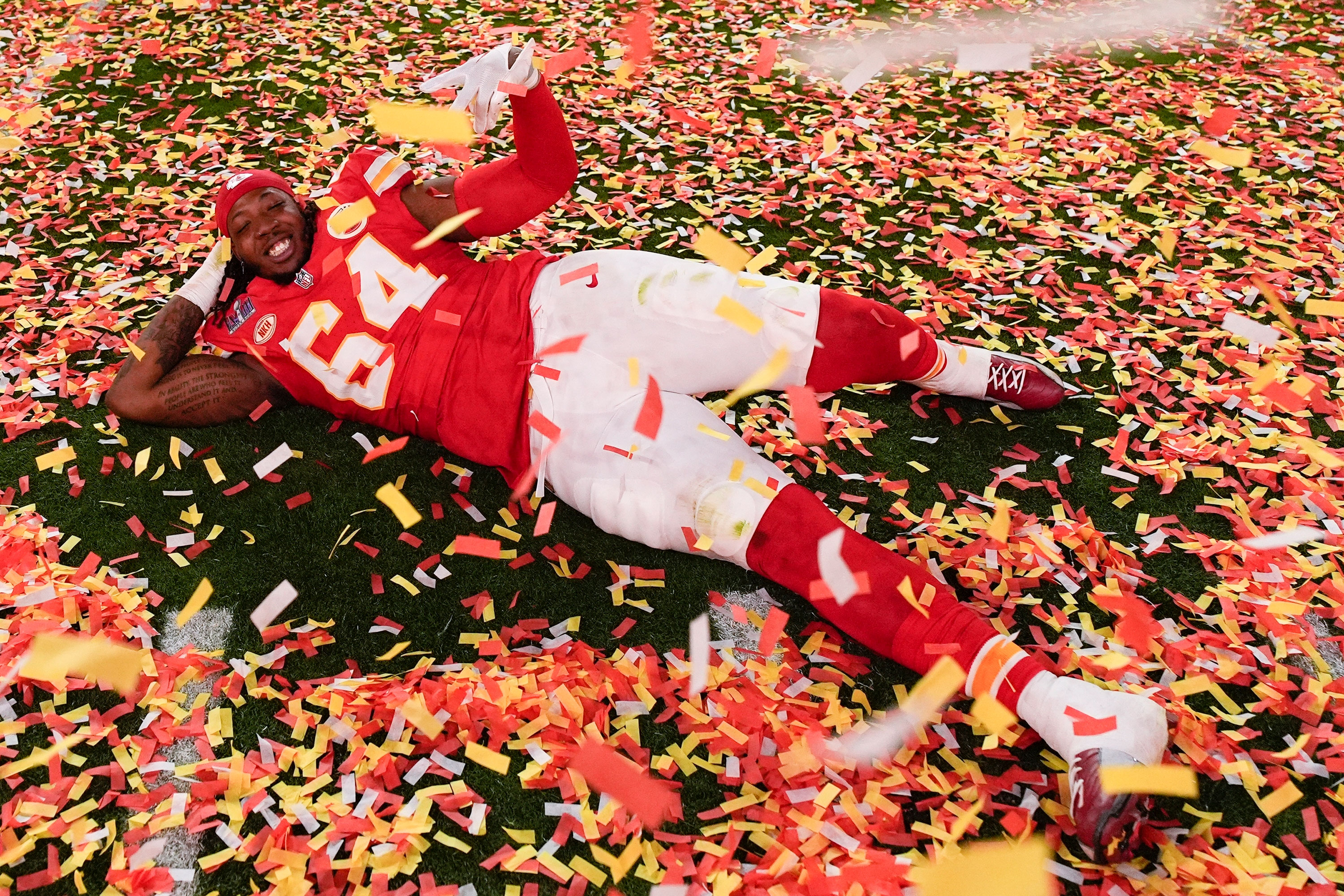 Kansas City Chiefs offensive tackle Wanya Morris celebrates on the field.
