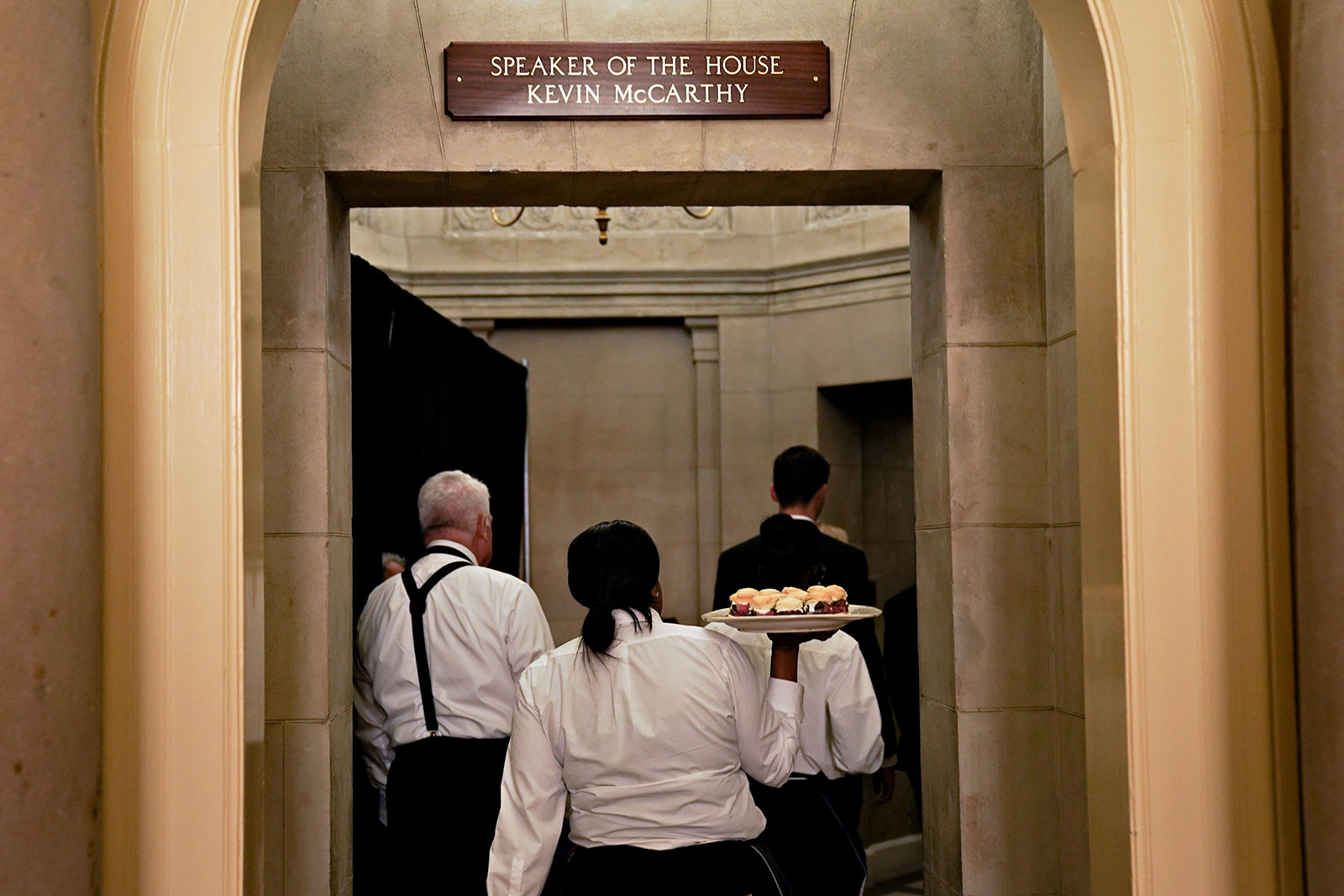 A worker delivers food to McCarthy's office.