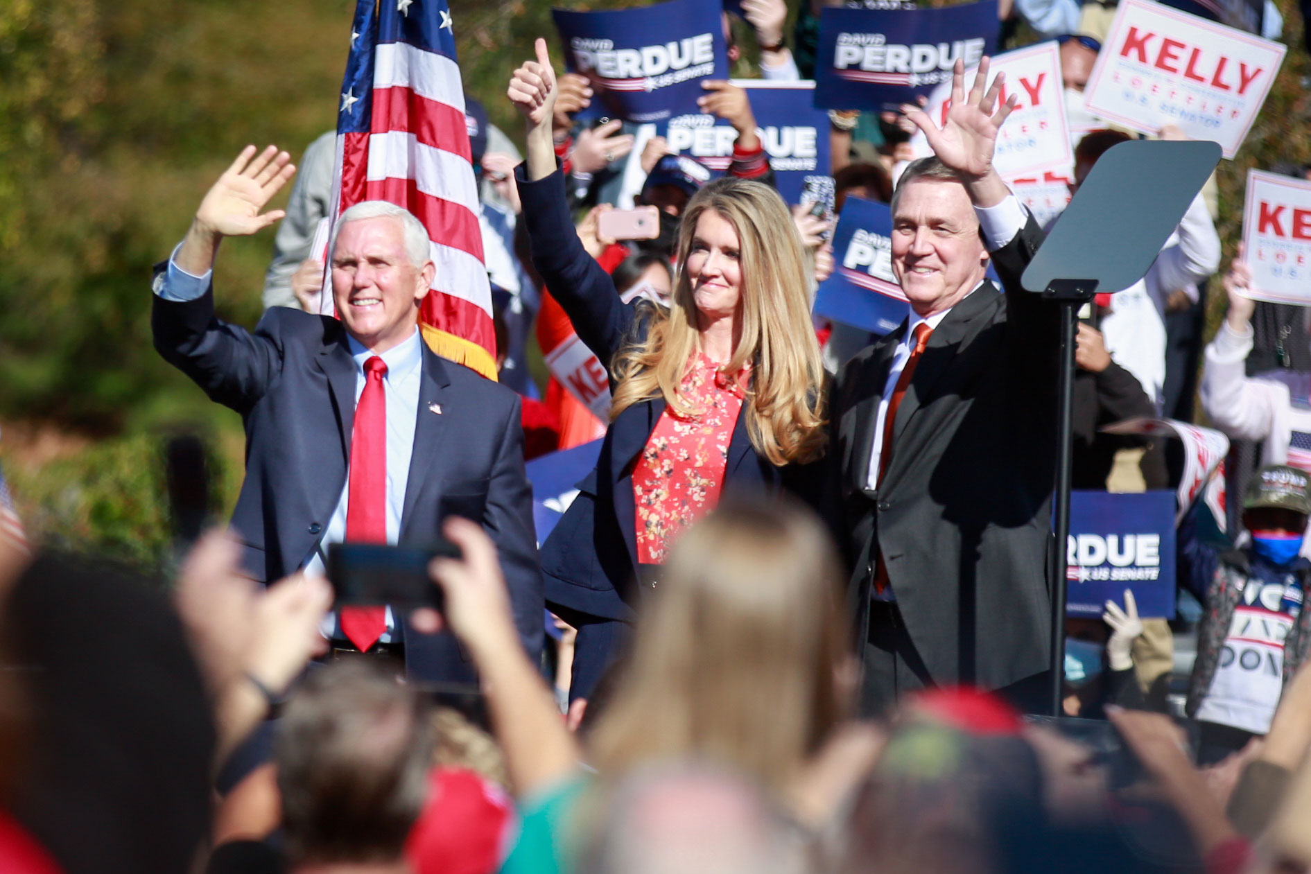 Vice President Mike Pence, Sen. Kelly Loeffler and Sen. David Perdue wave to supporters at a campaign rally in Canton, Georgia, on November 20.