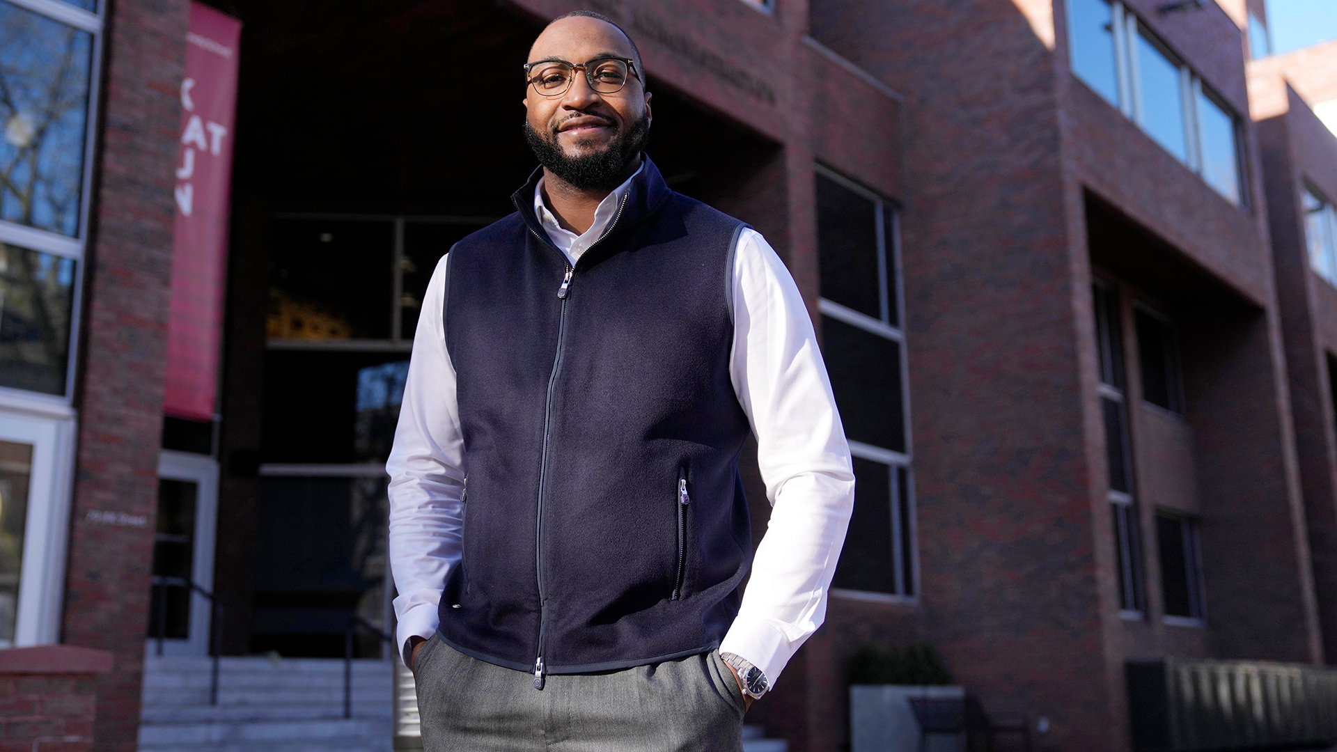 Quentin Fulks, who managed Sen. Raphael Warnock's re-election campaign in 2022, stands for a portrait outside the John F. Kennedy School of Government at Harvard University in February.