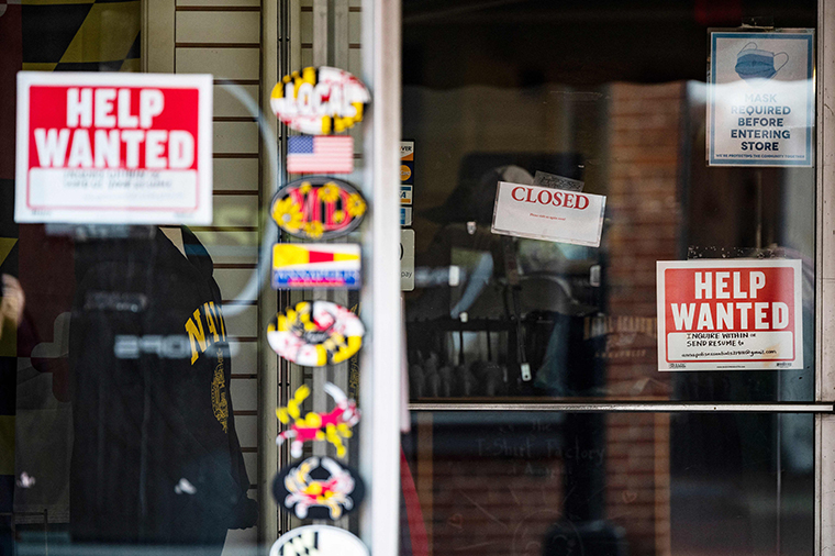 A store advertises a Help Wanted sign in Annapolis, Maryland, on May 12, 2021.