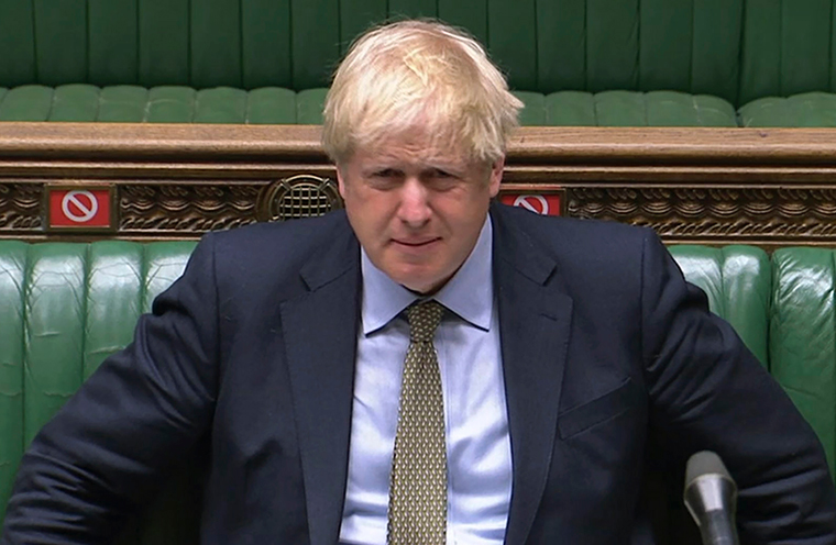  Britain's Prime Minister Boris Johnson reacts, during Prime Minister's Questions in the House of Commons, London, Wednesday July 22. 