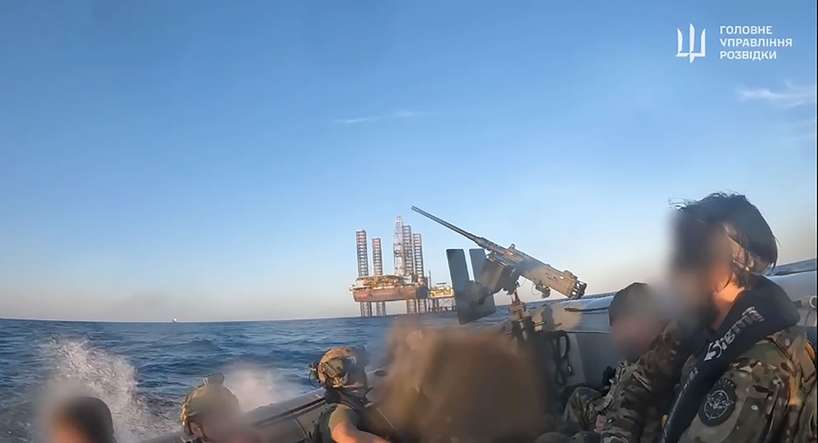 A screengrab from a video released by the Ukraine Defense Intelligence shows Ukrainian special forces during an operation to take control of Bokyo Towers off the northwest coast of Crimea. Portions of this image have been blurred by the Ukraine Defense Intelligence.