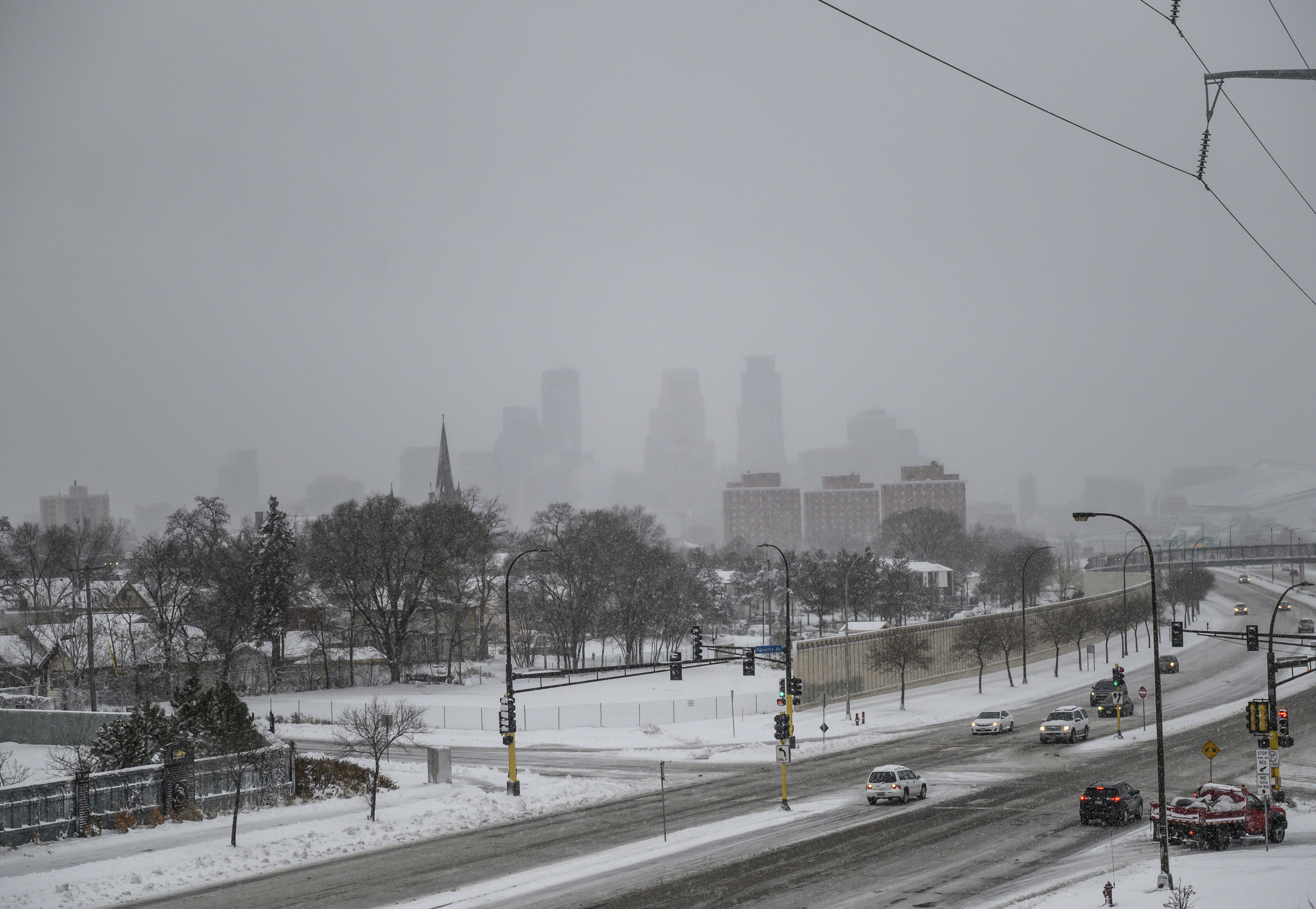 Snow continues to fall in Minneapolis, Minnesota on Wednesday.