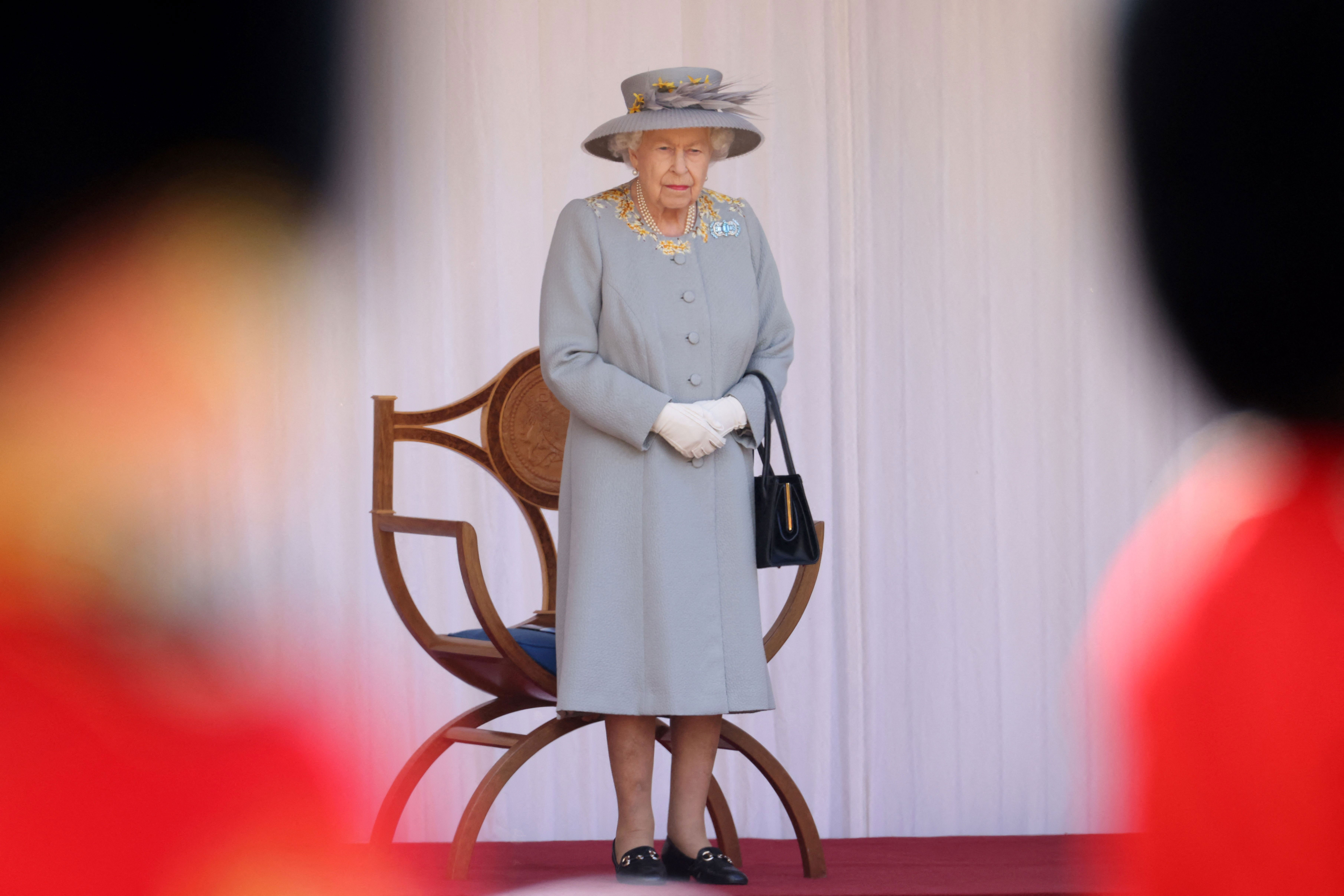 Queen Elizabeth II watches a military ceremony at Windsor Castle in England on June 12.