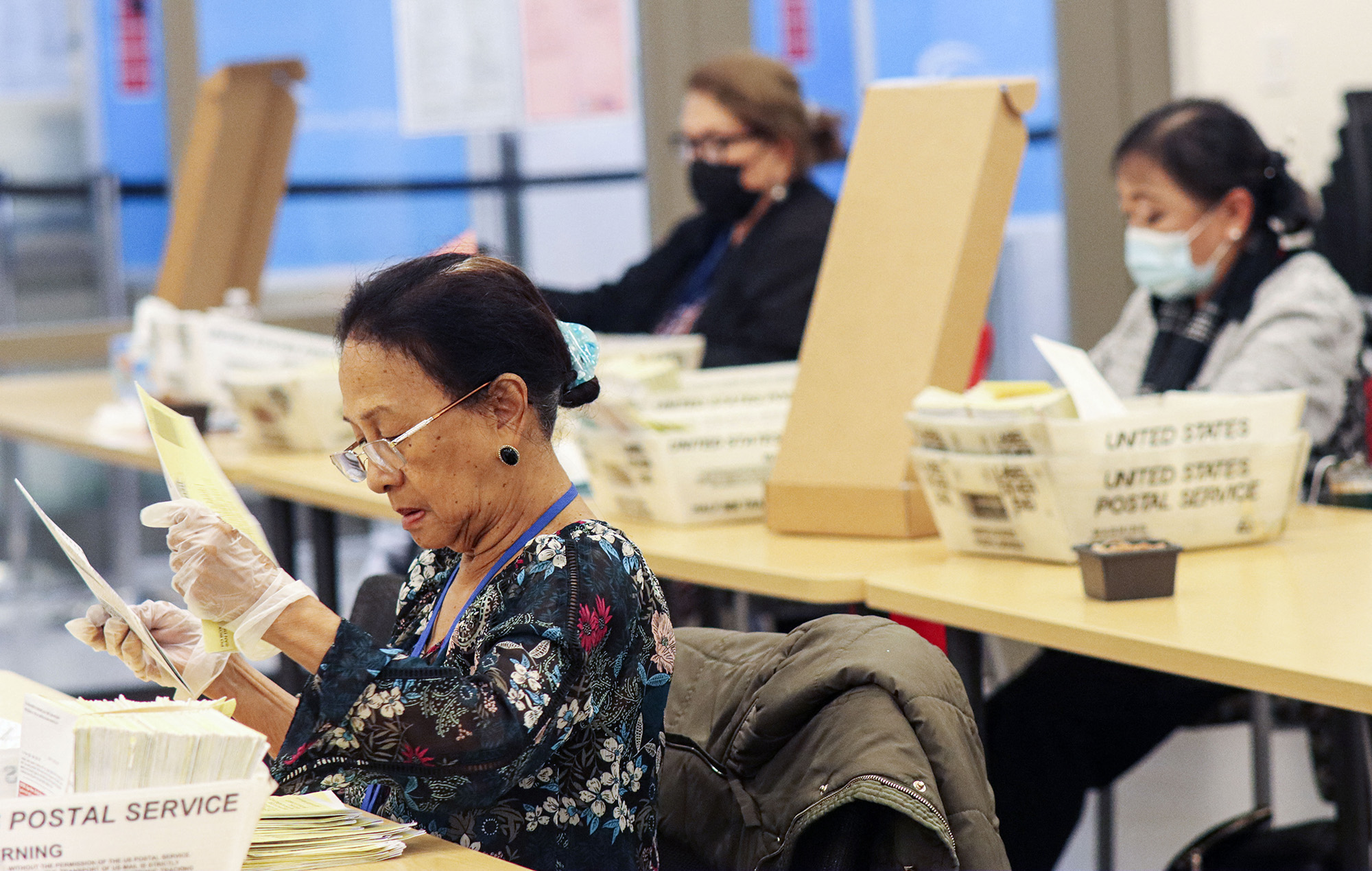 Poll workers sort ballots at The San Diego County Registrar of Voters, on the eve of the US midterm elections, in San Diego, California, on November 7.