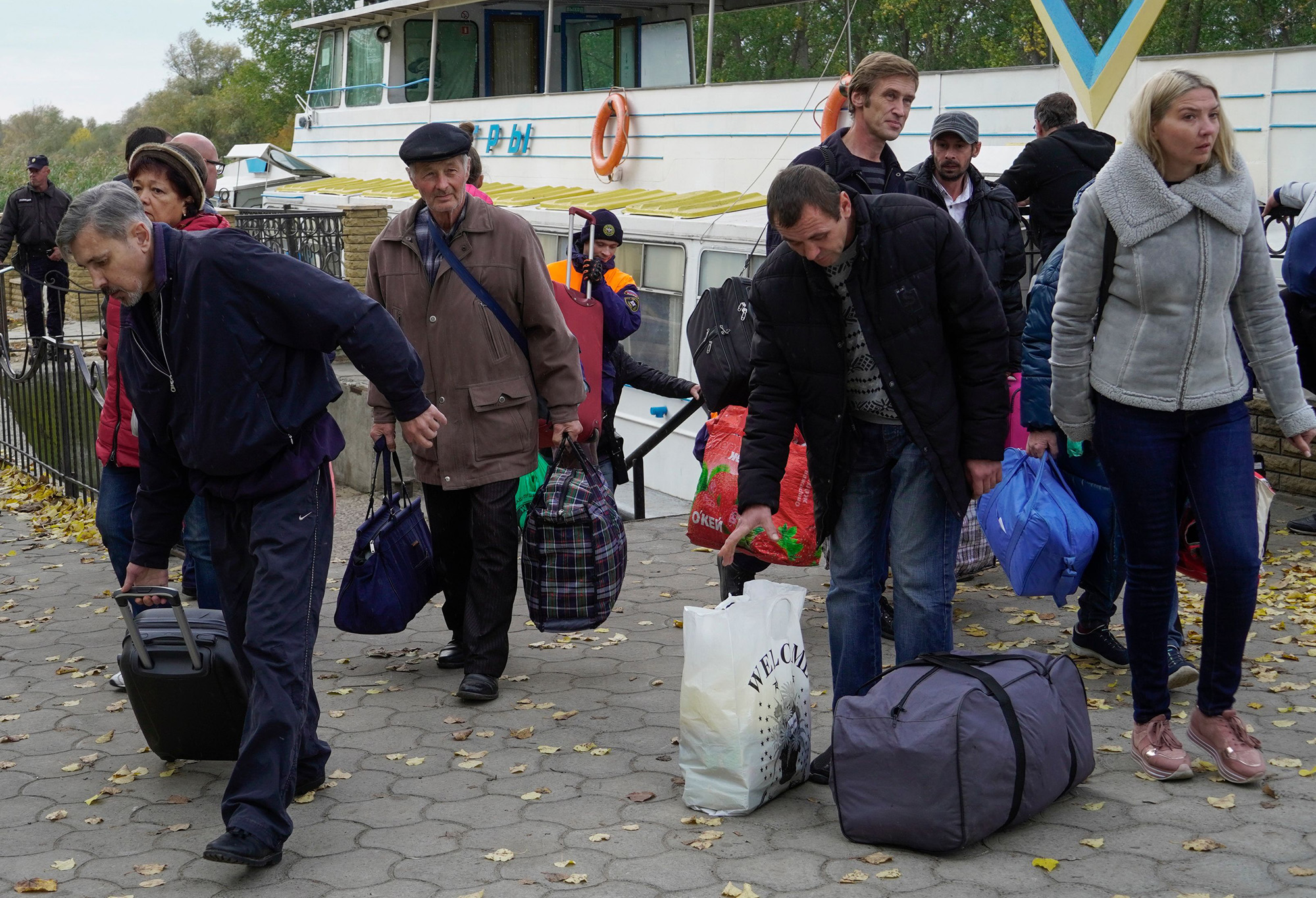 Residents evacuated from Kherson arrive in Oleshky, Kherson region, Ukraine, on October 25.