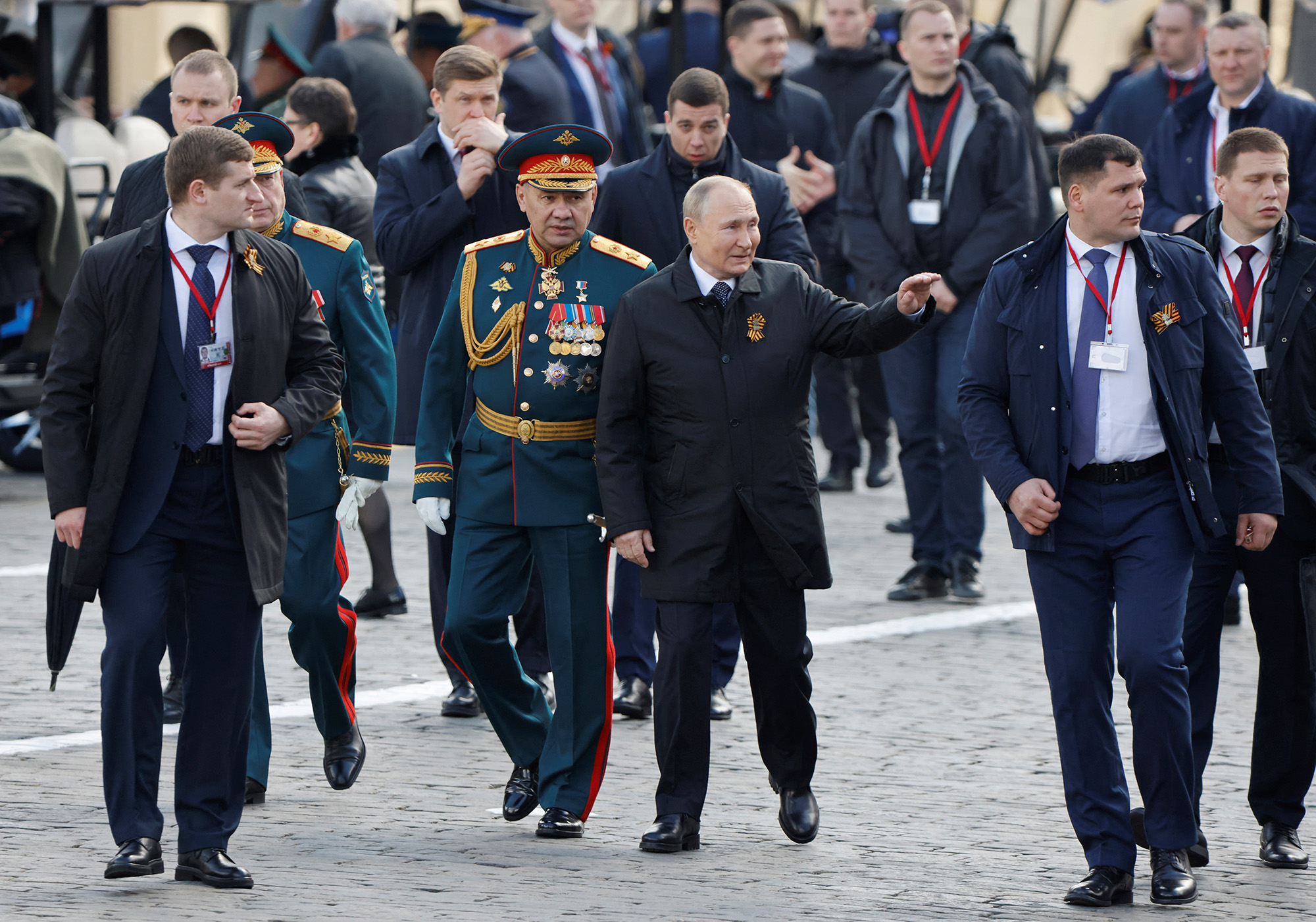 Russian President Vladimir Putin, center, and Defence Minister Sergei Shoigu, center left, walk after a military parade on Victory Day in Red Square in central Moscow, Russia, on May 9.