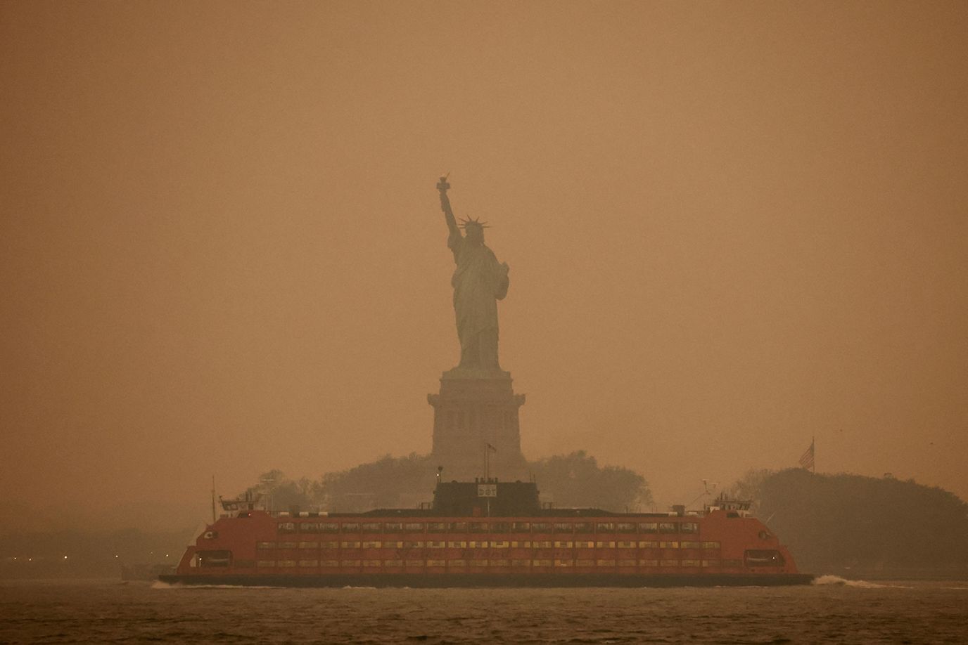 The Statue of Liberty in New York is obscured by the pollution caused by wildfires in Canada on June 6.