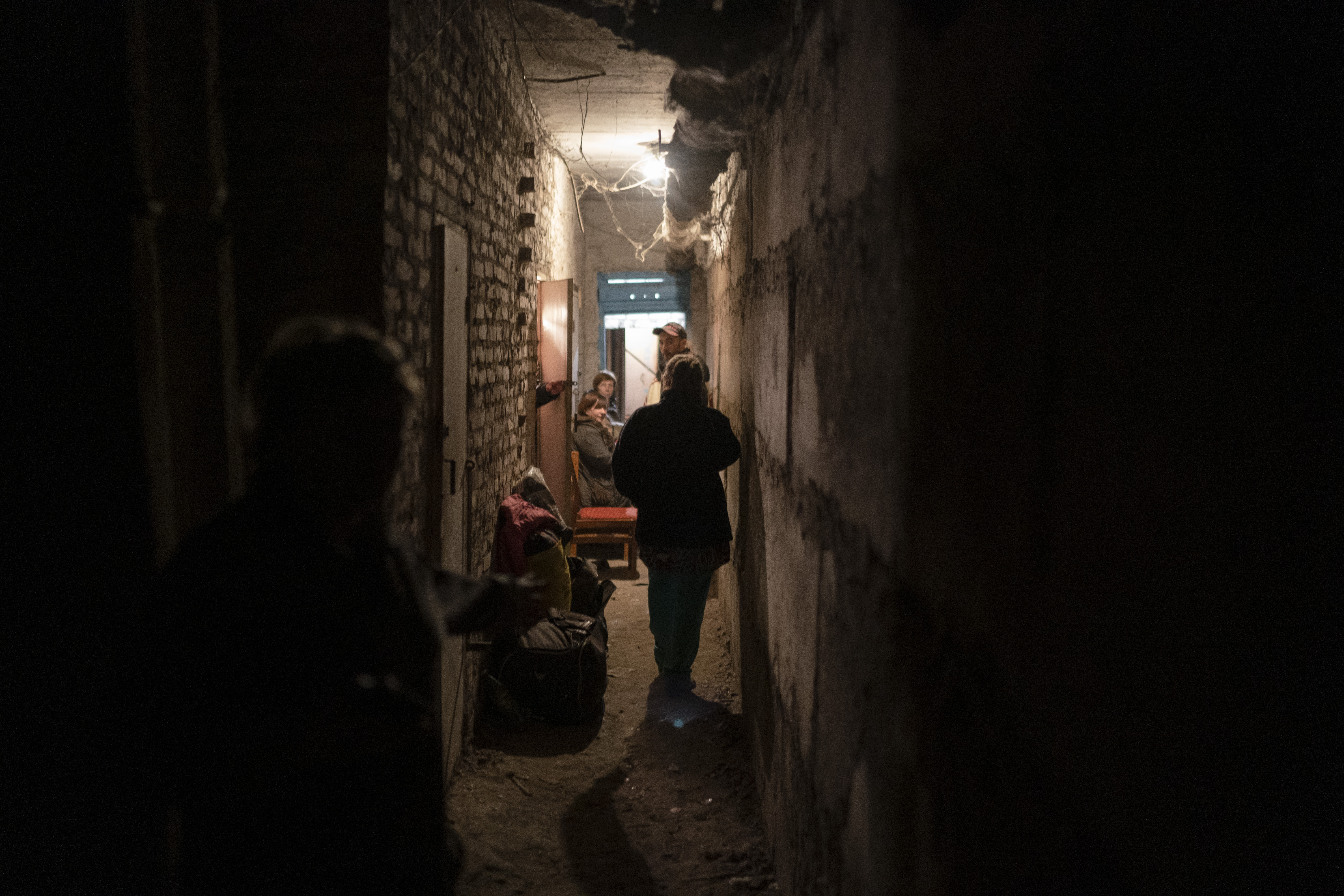 People shelter in the basement of a residential building during a Russian attack in Lyman, Ukraine, on April 26. 