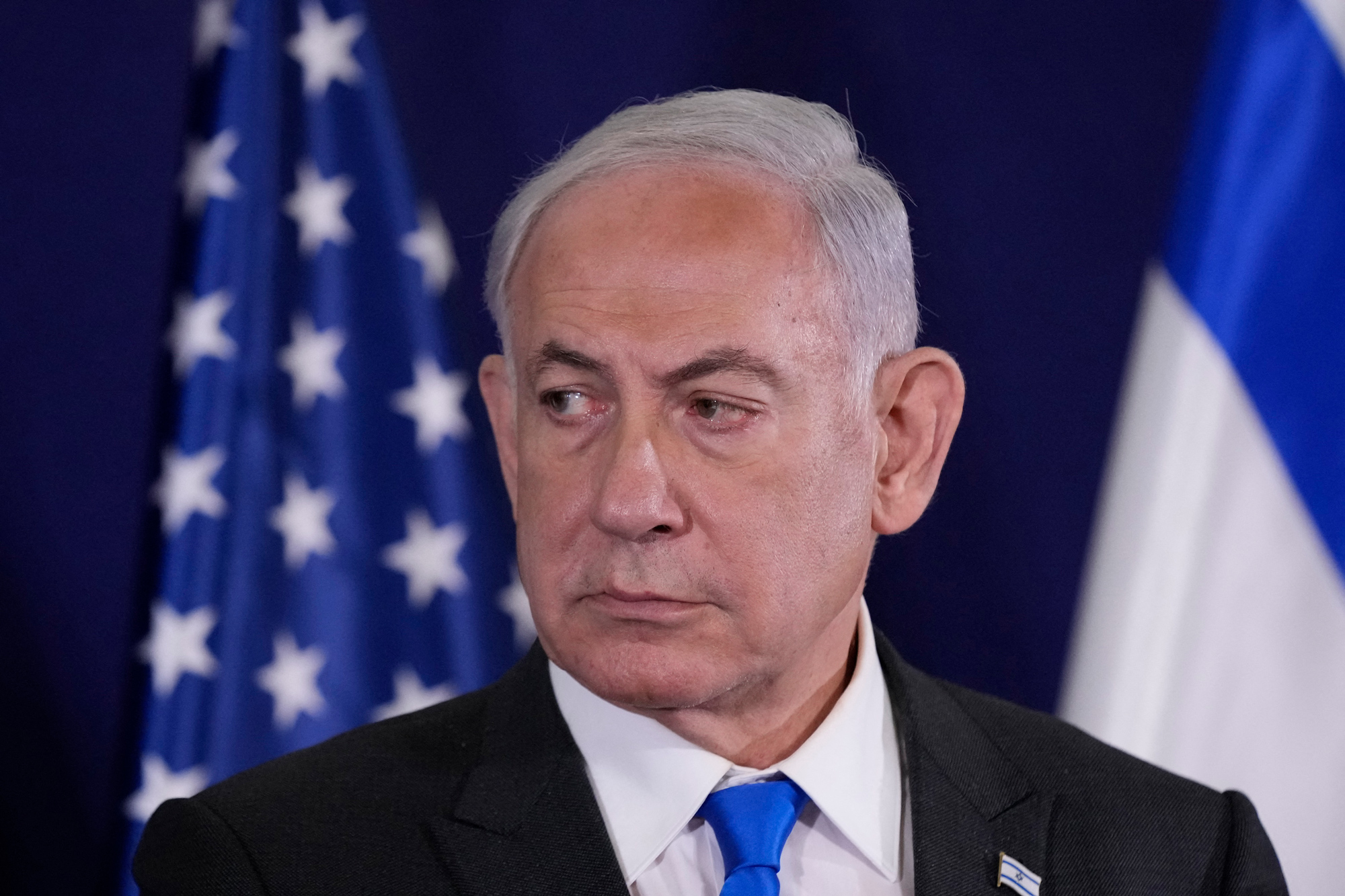 Israeli Prime Minister Benjamin Netanyahu looks on as the US Secretary of State gives statements to the media inside The Kirya, which houses the Israeli Defense Ministry, after their meeting in Tel Aviv, Israel, on October 12, 2023.