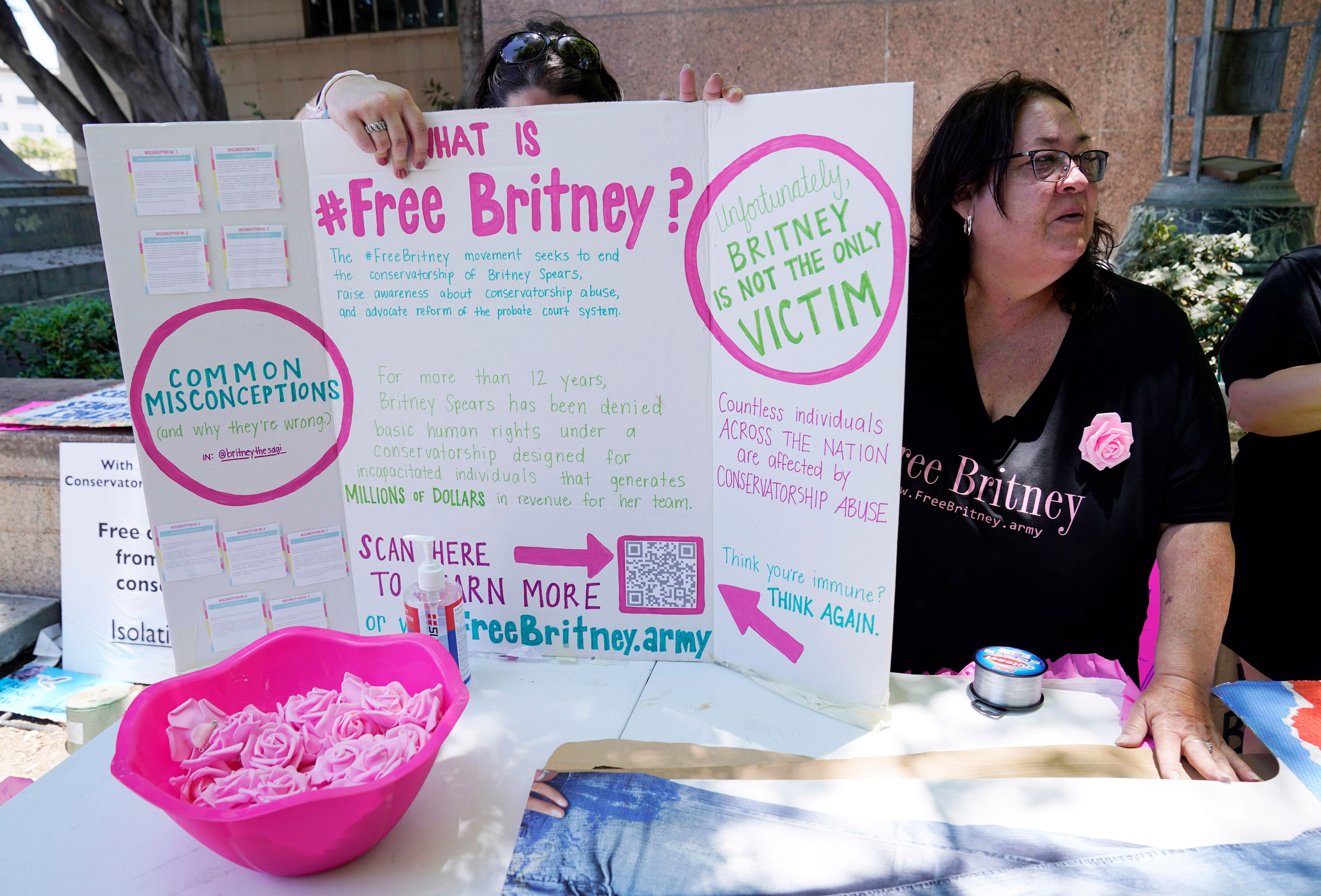 Britney Spears supporters Jan Simmons, right, of Detroit, and her daughter Leanne set up an informational table outside the courthouse.