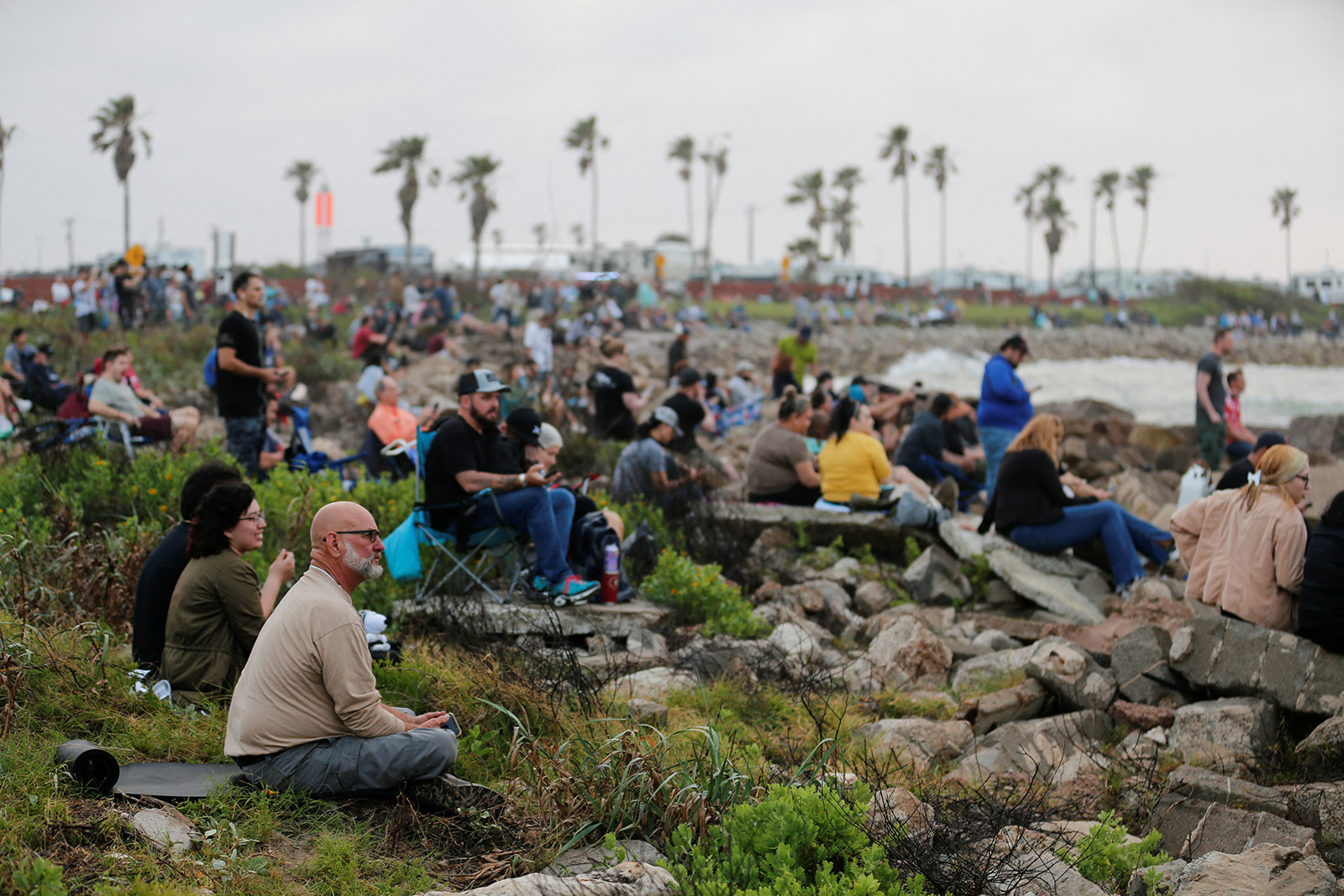 People wait before SpaceX's Starship spacecraft launch in Brownsville, Texas, on Thursday, April 20.