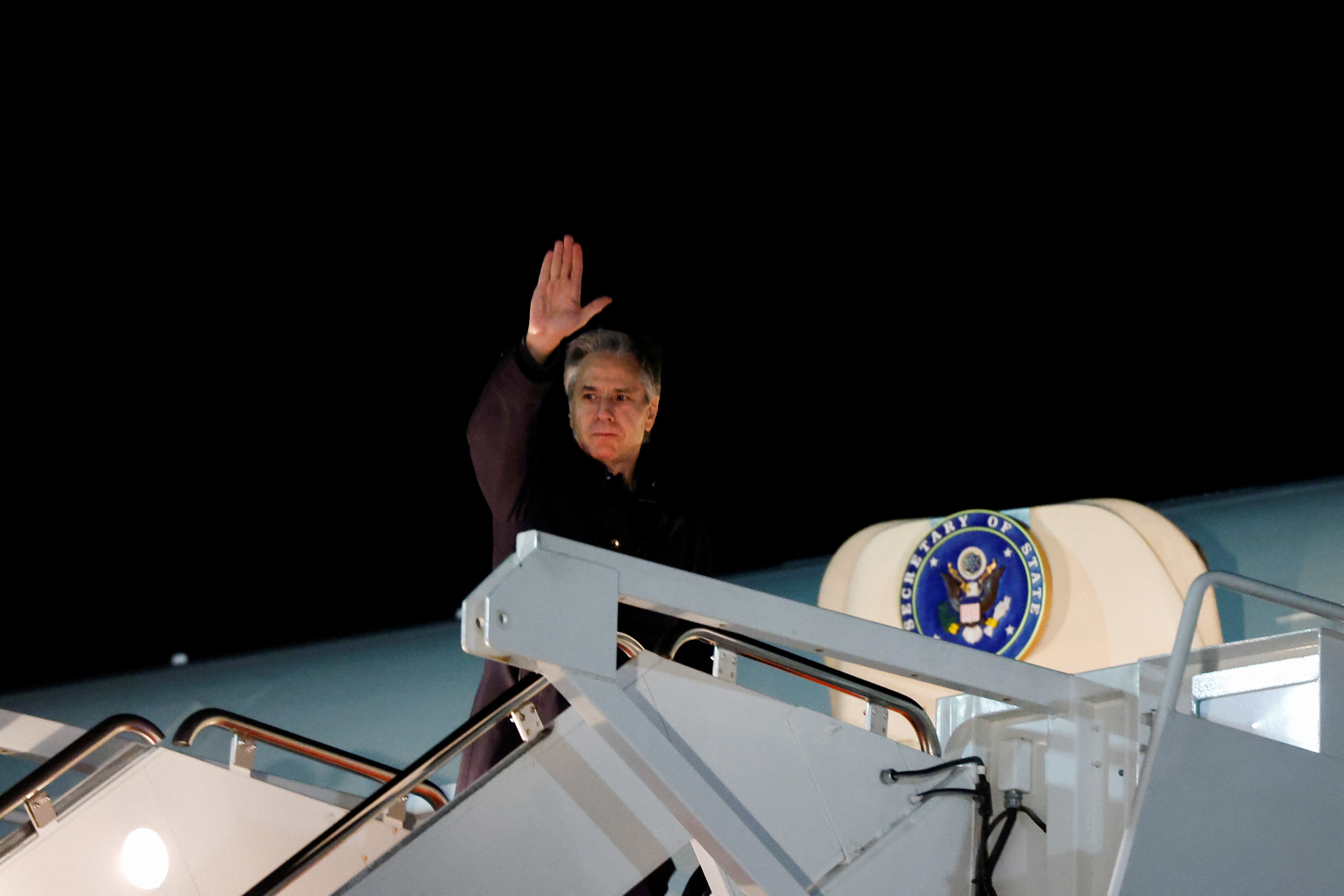 U.S. Secretary of State Antony Blinken waves as he boards an aircraft during his departure from Washington to travel to the Middle East at Joint Base Andrews, Maryland, U.S., on January 4.