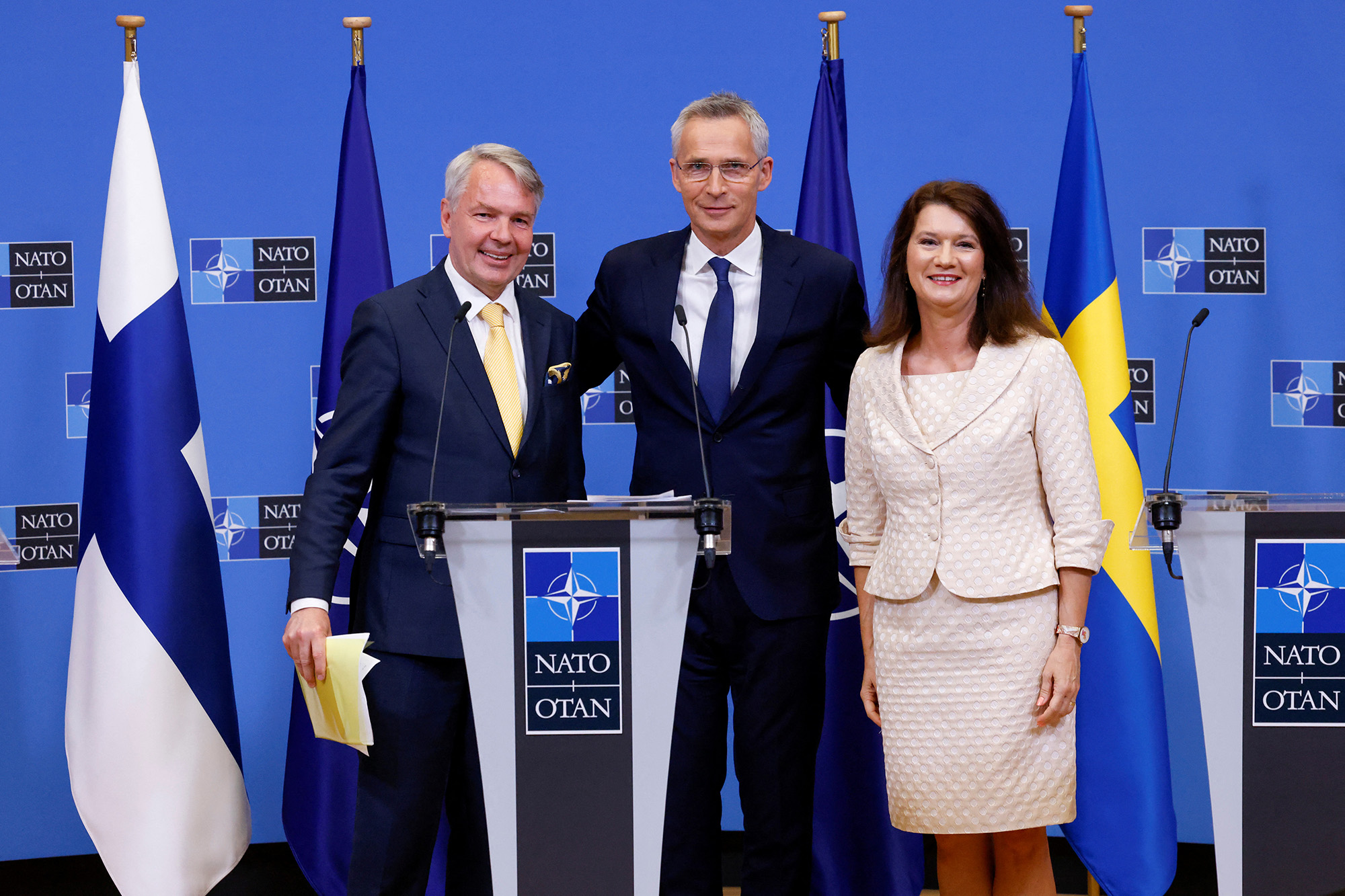 Sweden's Foreign Minister Ann Linde, right, and Finland's Foreign Minister Pekka Haavisto, left, attend a news conference with NATO Secretary General Jens Stoltenberg, after signing their countries' accession protocols at the alliance's headquarters in Brussels, Belgium, on July 5.