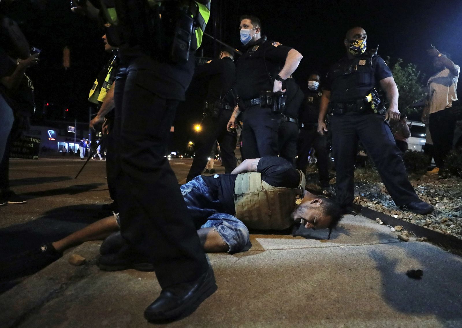 A protester winces in pain after being sprayed with pepper spray by police during a demonstration near the Memphis Police Department precinct in Memphis, Tennessee, on May 28.