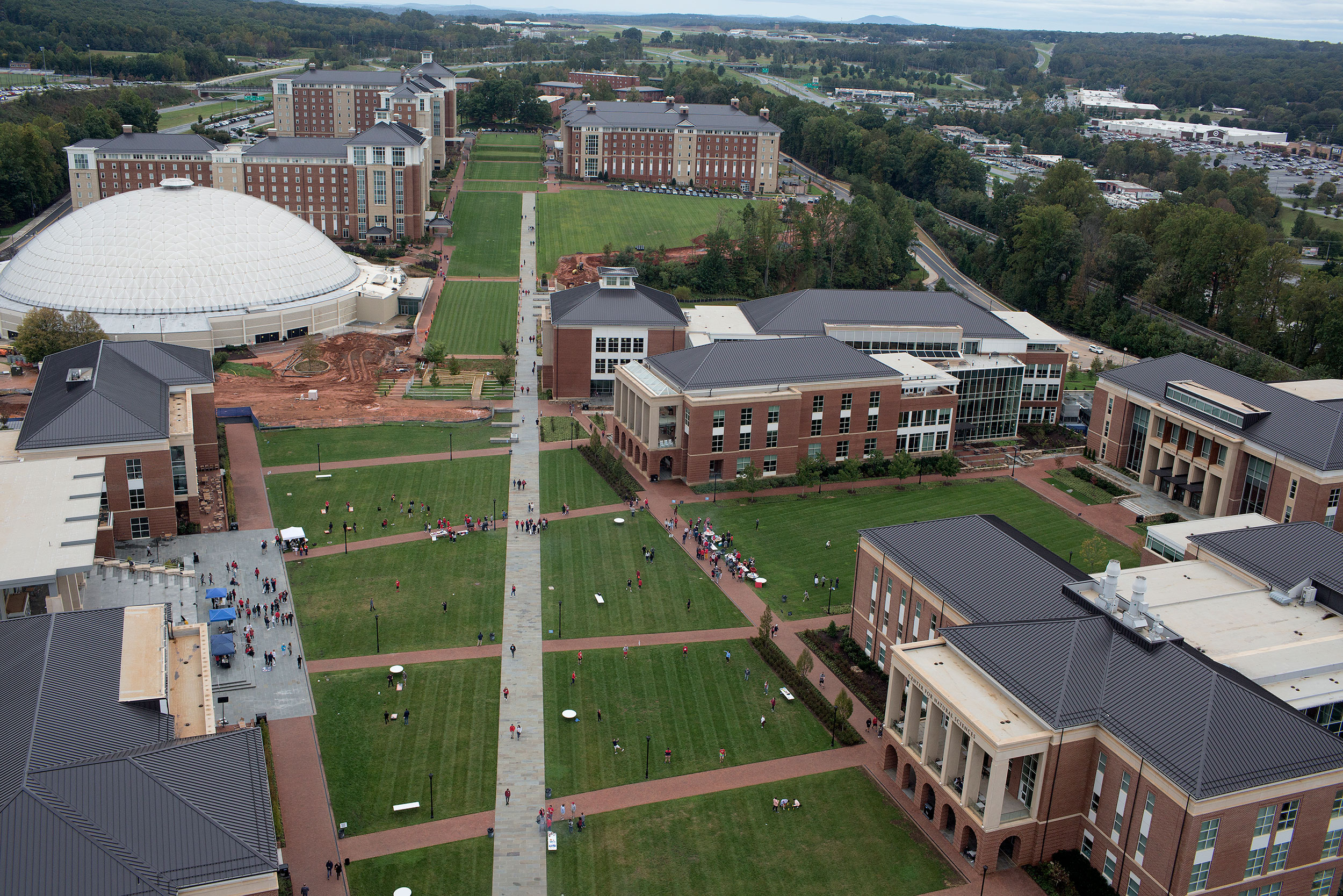 Students mingle on the campus lawn at Liberty University in 2018.