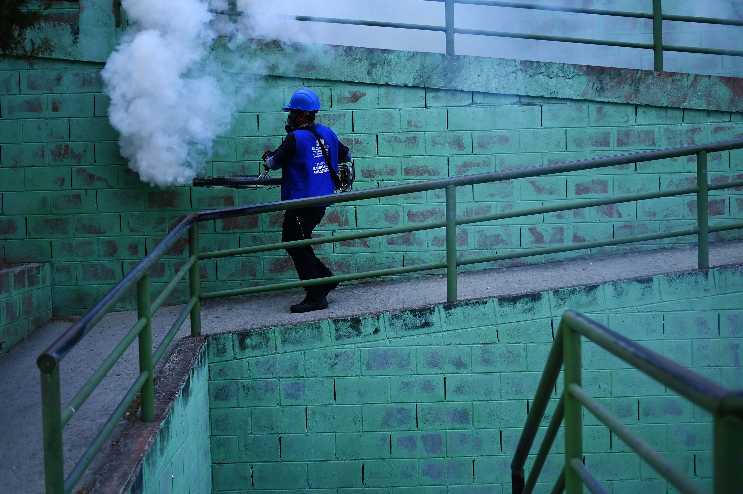 A municipal worker sanitizes a quarantined homeless shelter in San Salvador, El Salvador, on April 2.