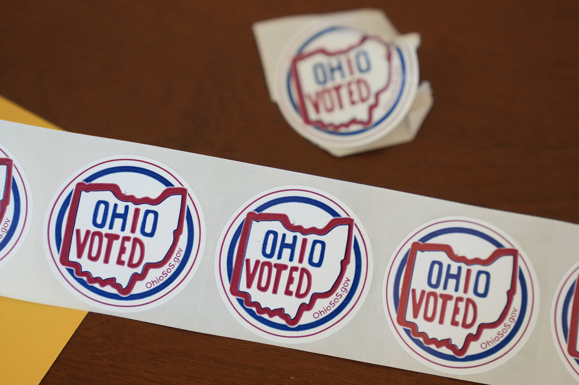 "Ohio Voted" stickers await voters after they cast their ballots at the Meadowbook Golf Club in Clayton, Ohio Tuesday.