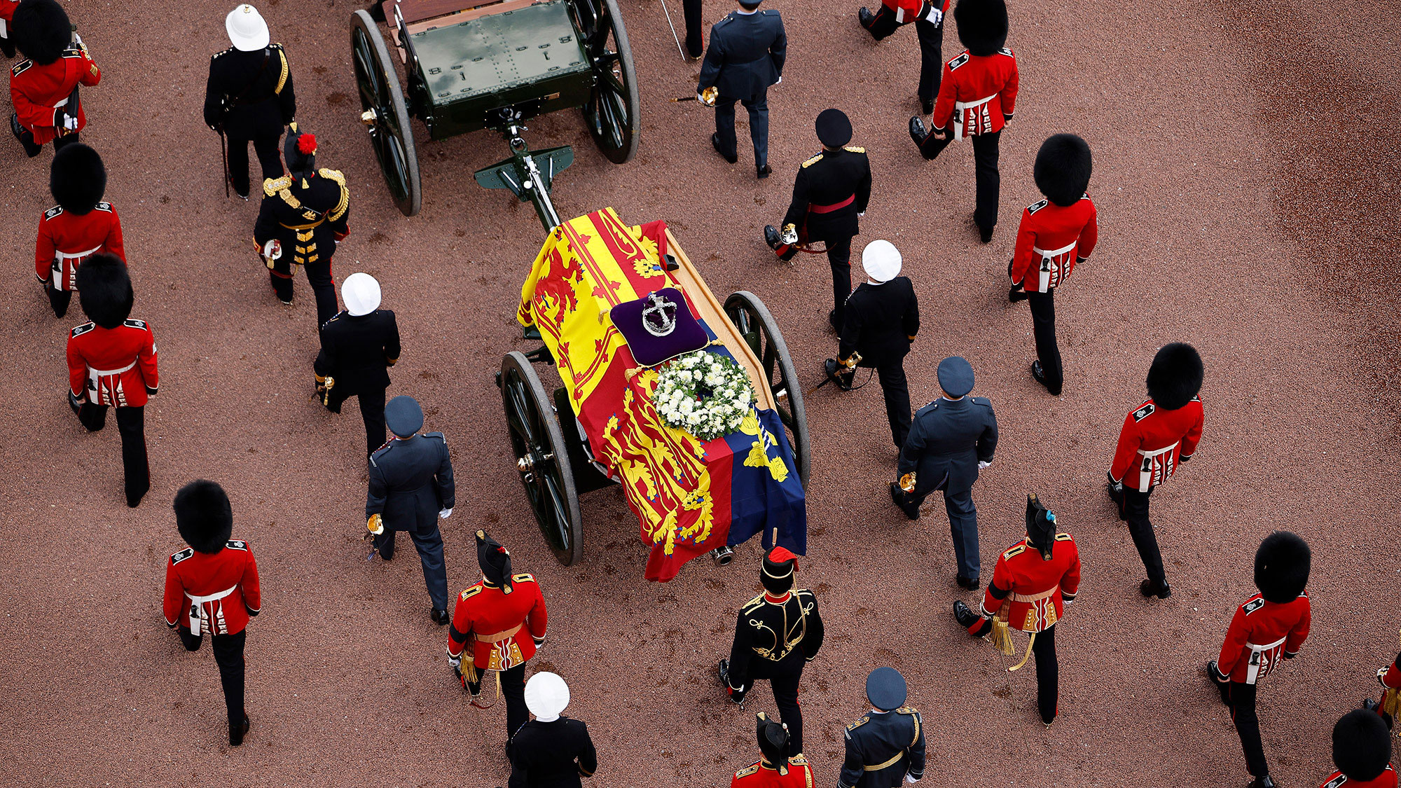 The Queen's coffin is covered with the Royal Standard as it is carried to Westminster Hall.