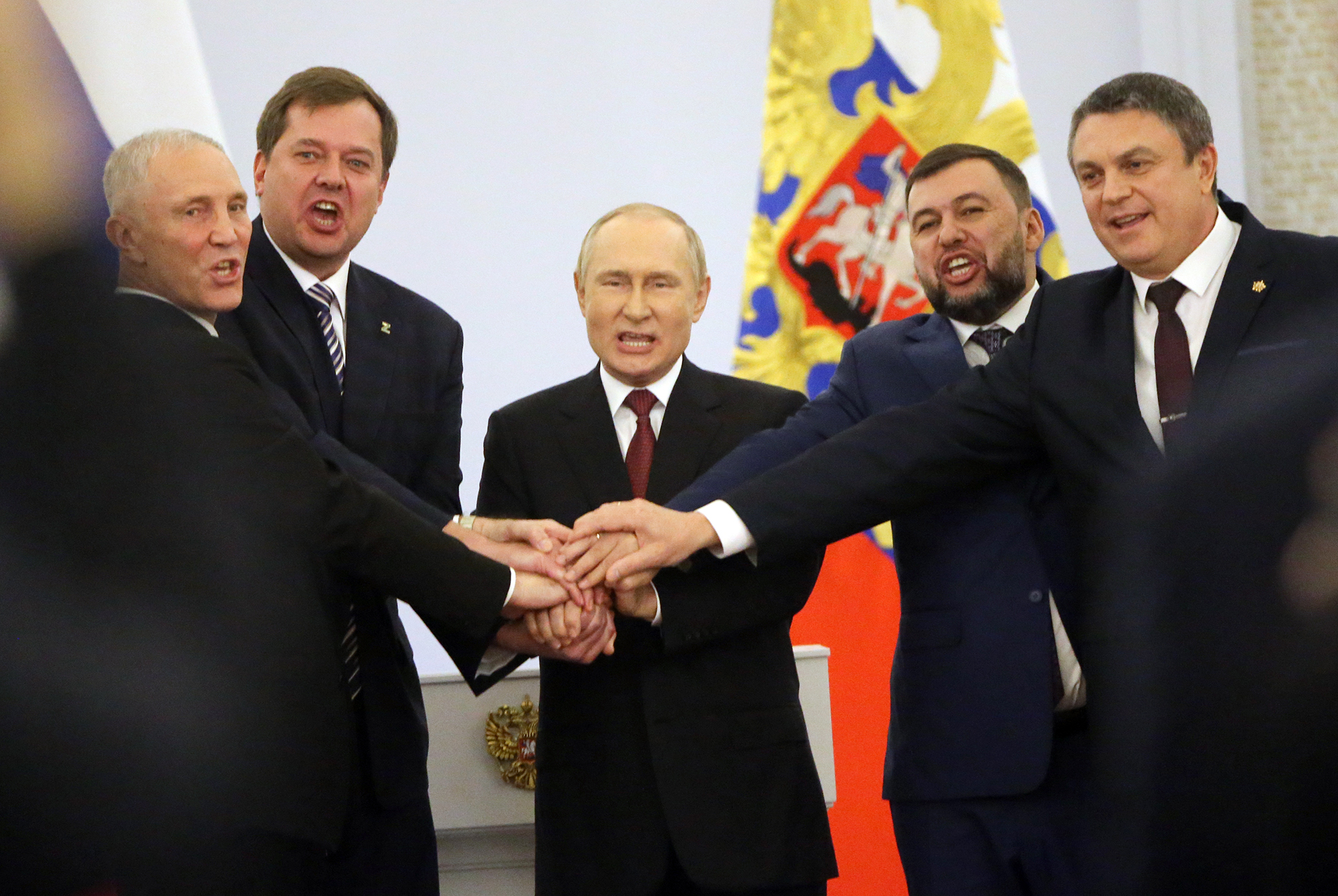 Russian President Vladimir Putin, center, with Ukrainian separatist regional leaders Vladimir Saldo, left, Yevgeniy Balitsky, second left, Leonid Pasechnik, right and Denis Pushilin, second right, seen during the annexation ceremony of four Ukrainian regions at the Grand Kremlin Palace, September 30, in Moscow, Russia. 