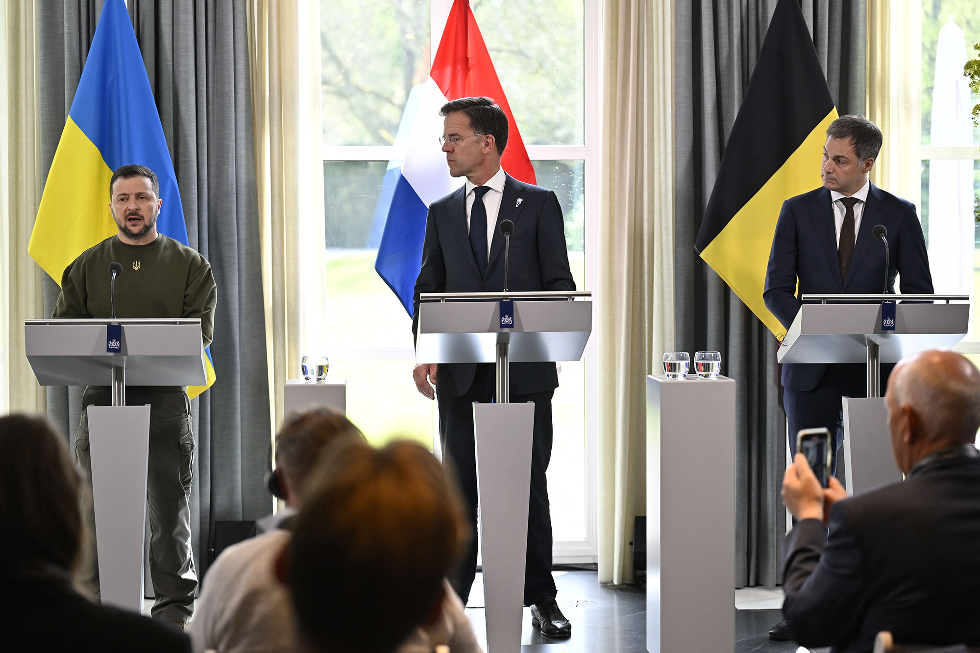 Ukraine president Volodymyr Zelensky, left, Prime Minister of the Netherlands Mark Rutte, center, and Prime Minister Alexander De Croo talk to the press after a meeting regarding the situation in Ukraine in The Hague, Netherlands, on May 4.