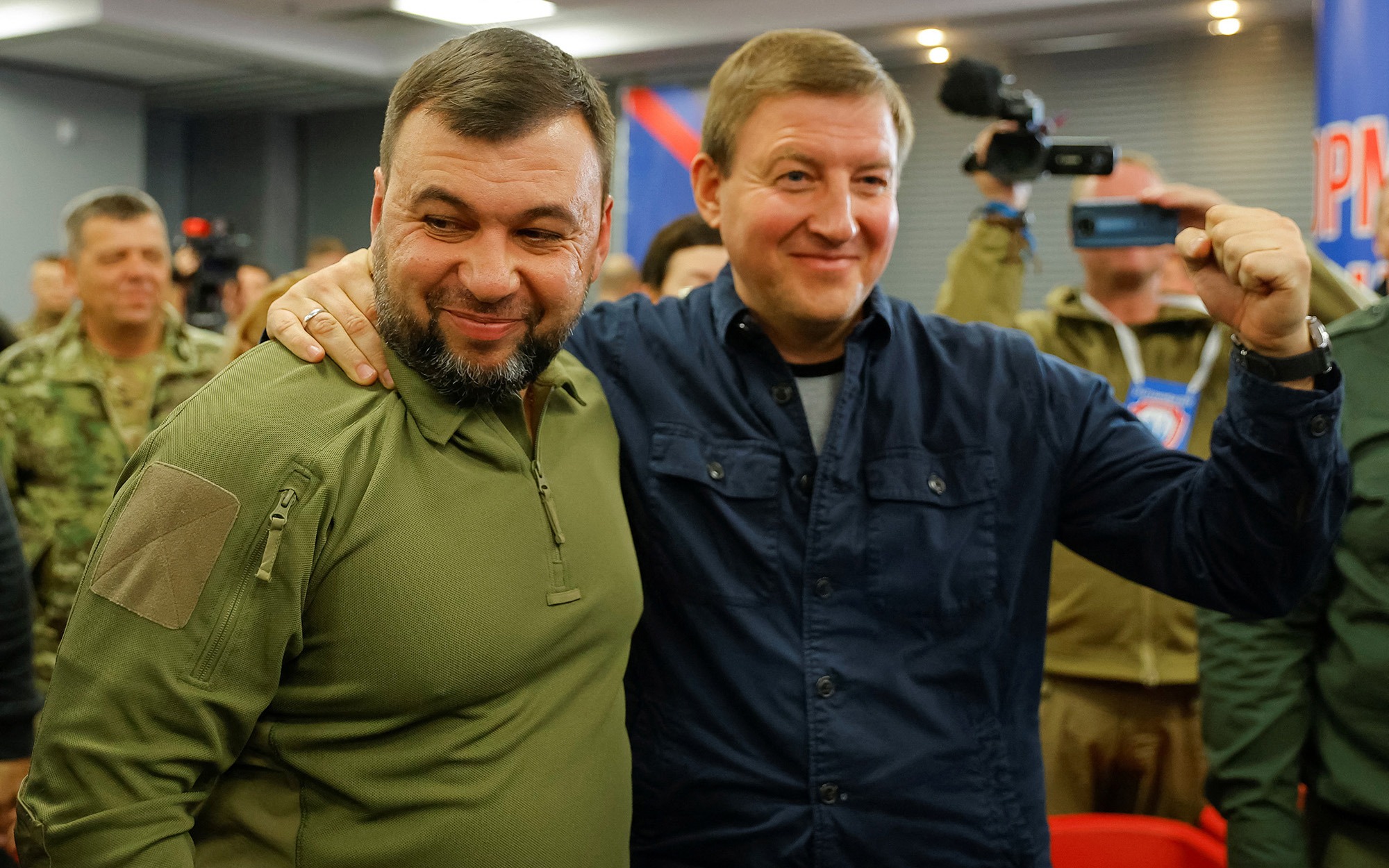 Head of the separatist self-proclaimed Donetsk People's Republic Denis Pushilin, left, and Secretary of the United Russia Party's General Council Andrey Turchak attend a news conference on preliminary results of a referendum on the joining of the self-proclaimed Donetsk People's Republic (DPR) to Russia, in Donetsk, Ukraine, on September 27.
