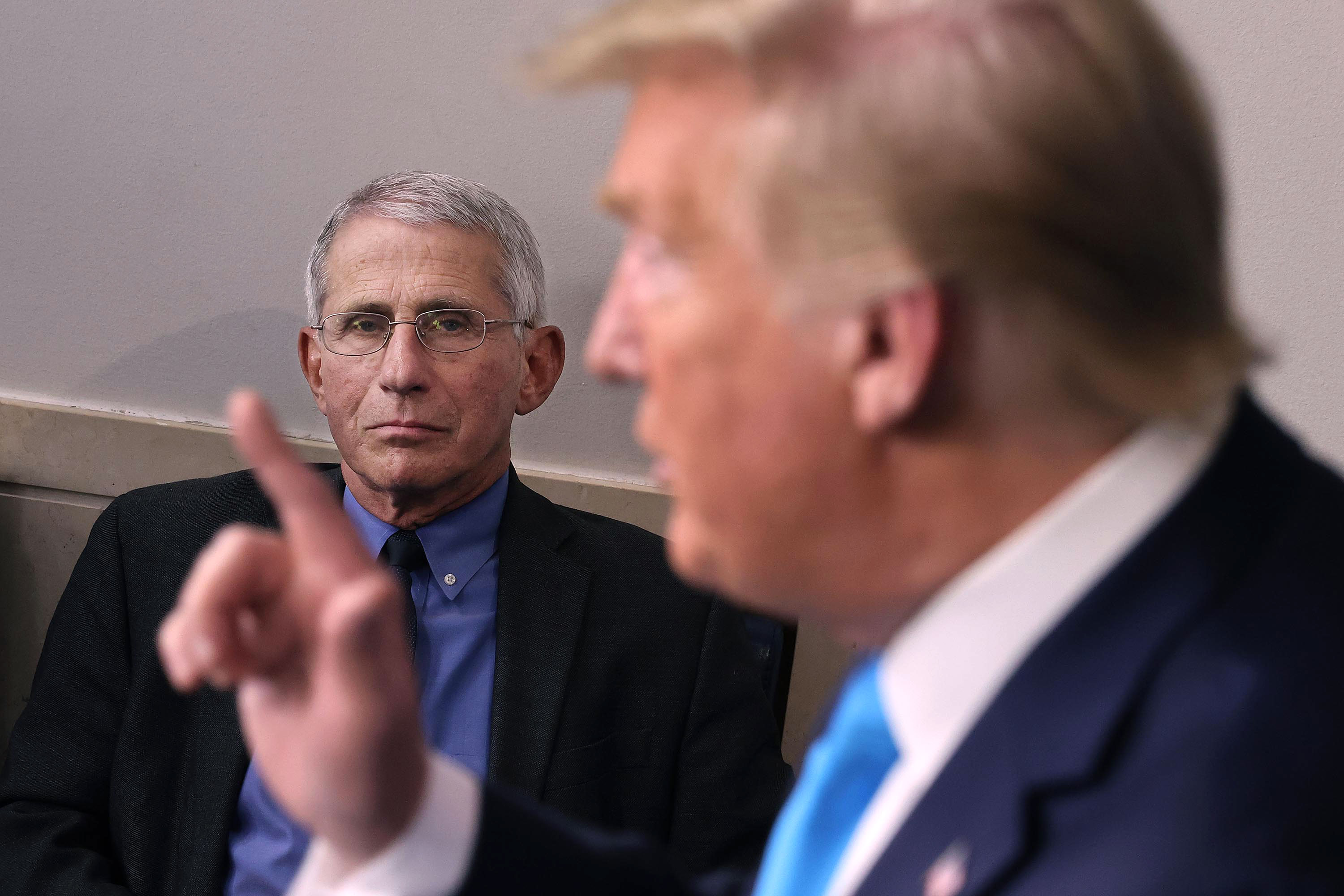 Anthony Fauci, director of the National Institute of Allergy and Infectious Diseases, listens to President Donald Trump speak during a coronavirus task briefing on April 7 in Washington, DC. 