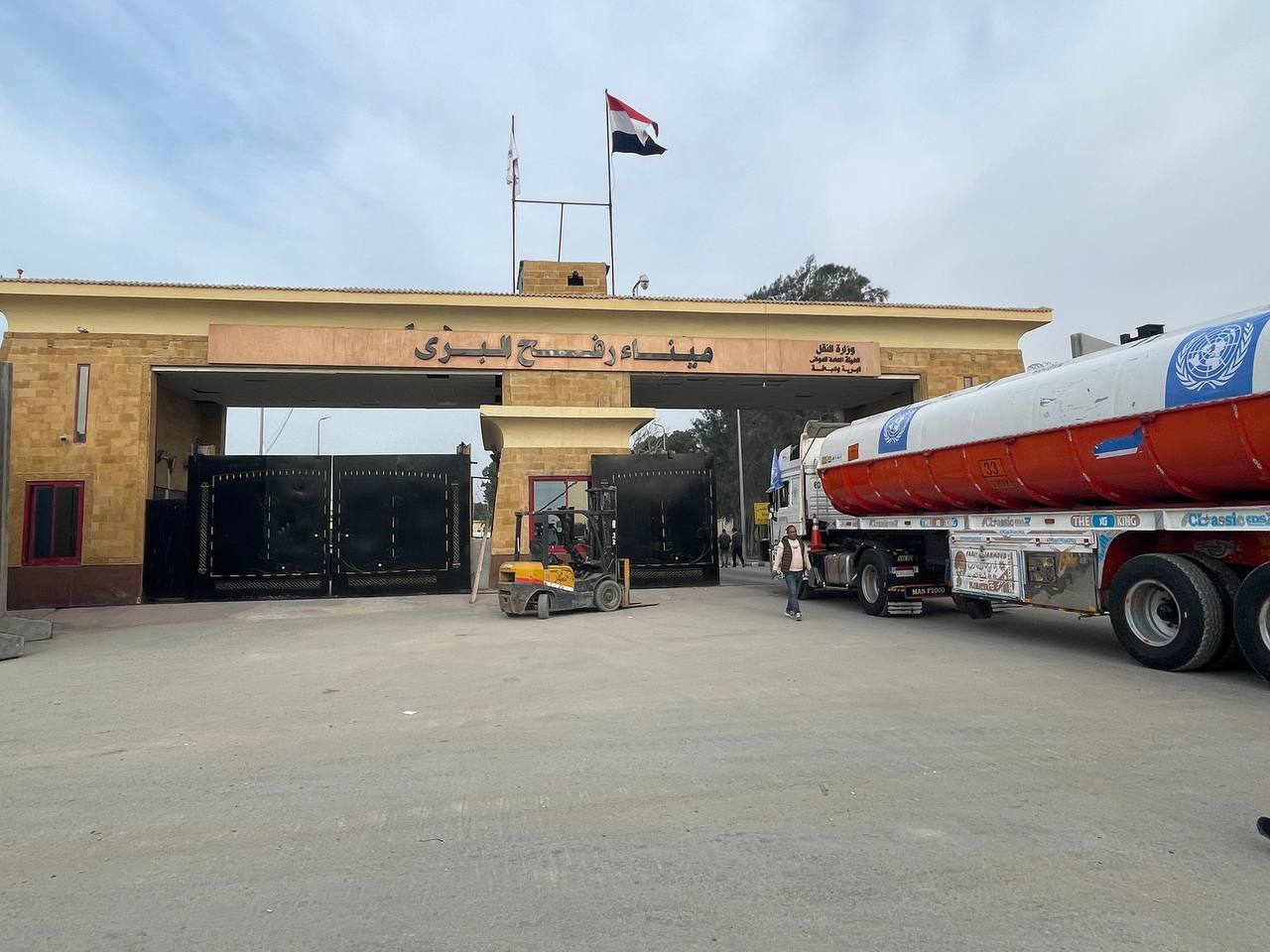 Trucks with humanitarian aid and fuel wait to enter Gaza through the Rafah border crossing in Egypt on Sunday, December 10.
