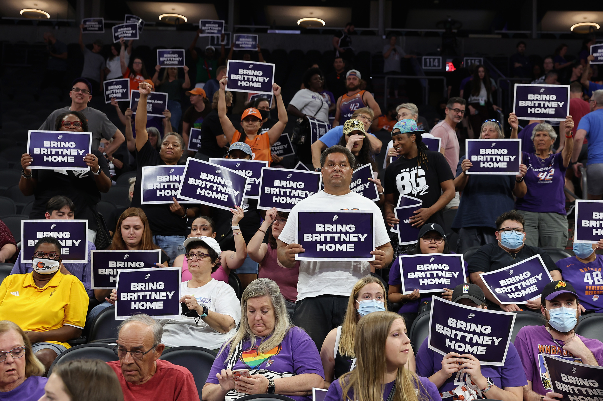 Supporters hold up signs reading "Bring Brittney Home" during a rally to support the release of detained basketball star Brittney Griner at Footprint Center on July 6, in Phoenix, Arizona. 