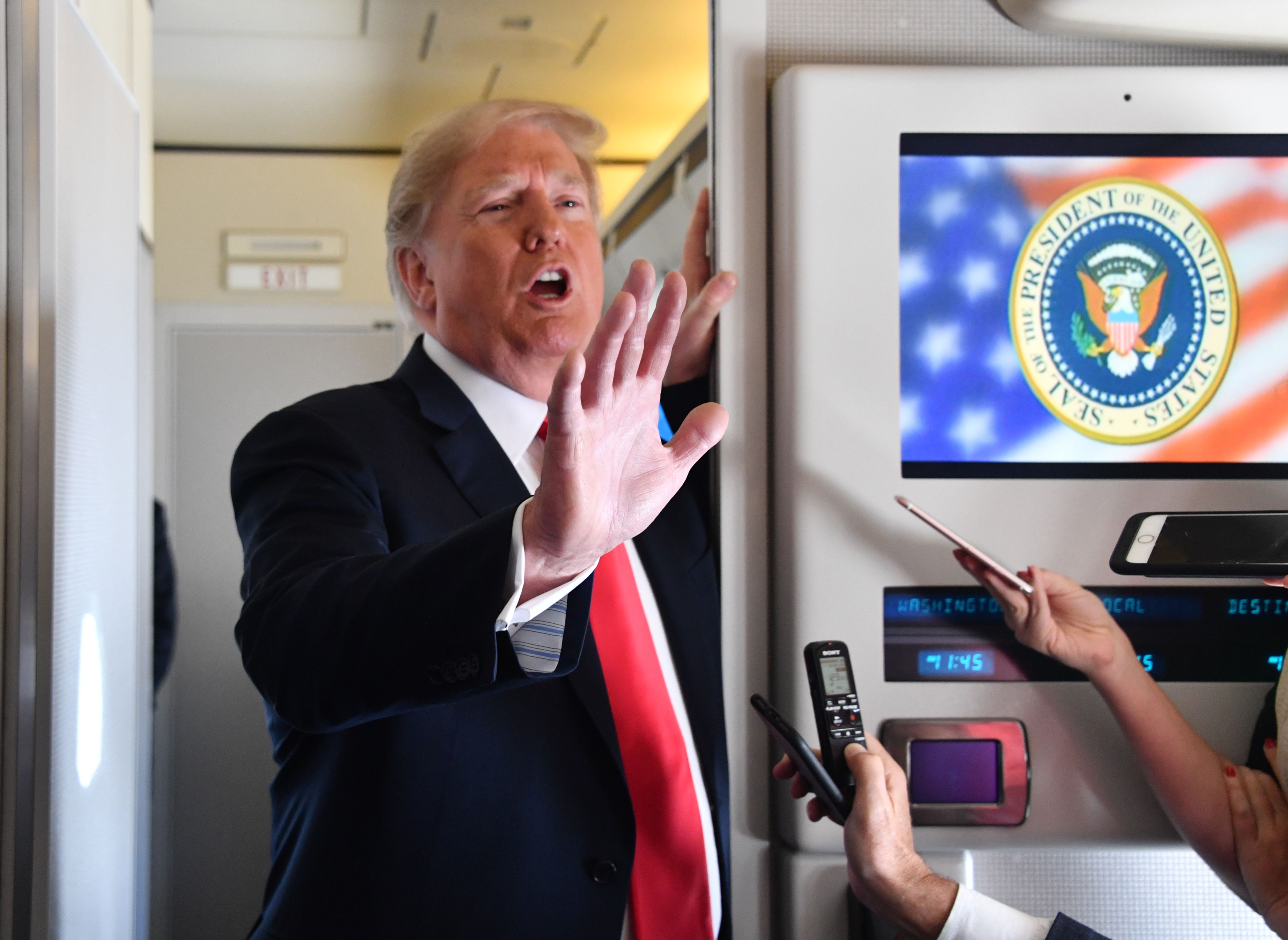 US President Donald Trump speaks to the press aboard Air Force One on September 7, 2018.