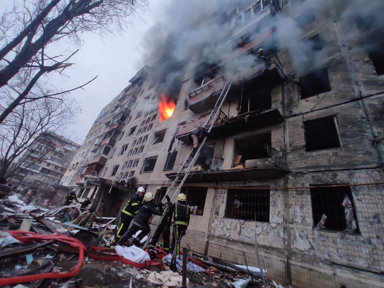 Firefighters work at a damaged apartment building in Kyiv, Ukraine, on March 14.