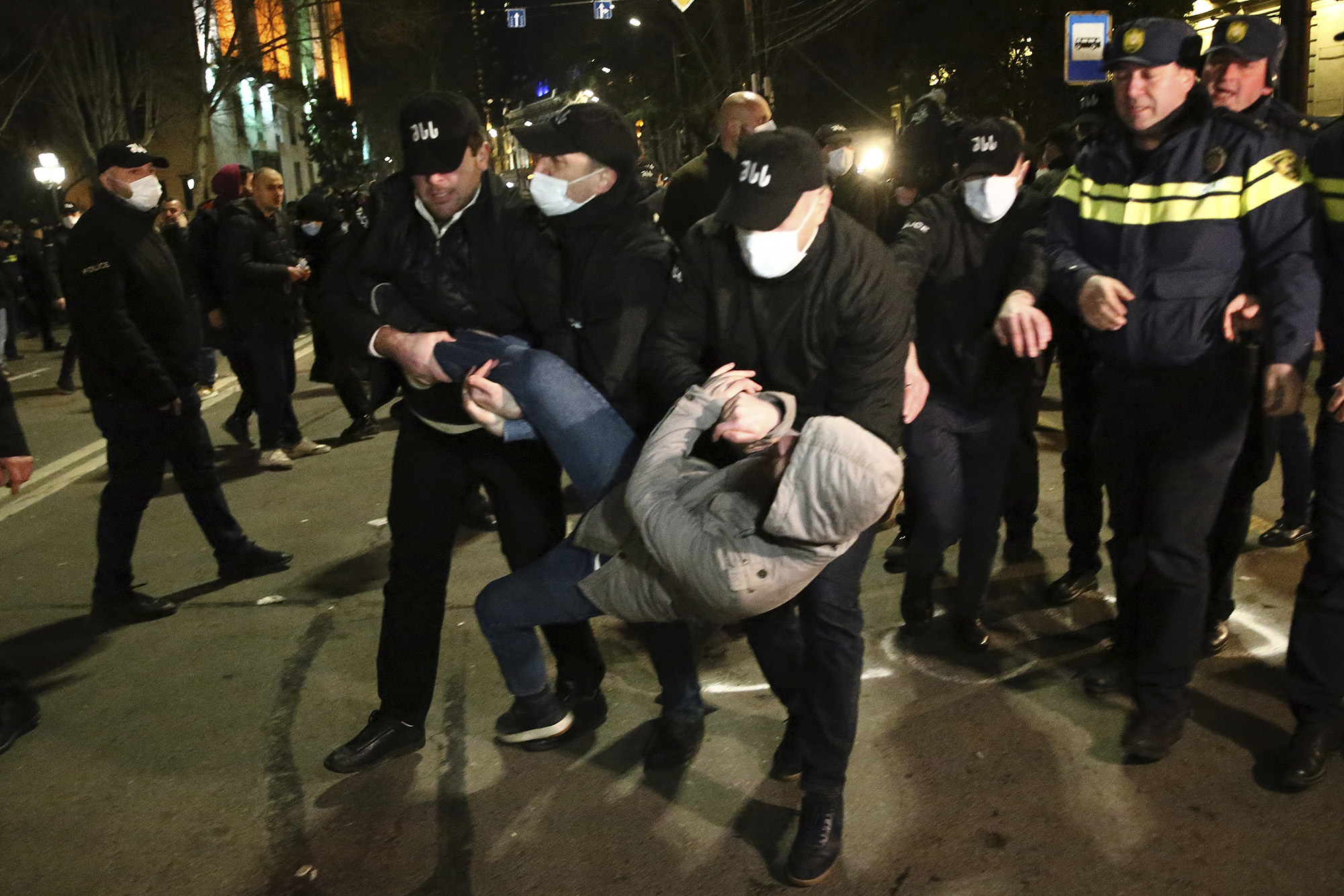 Georgian police detain a protester during a protest outside the Georgian parliament building in Tbilisi, Georgia, on March 8.