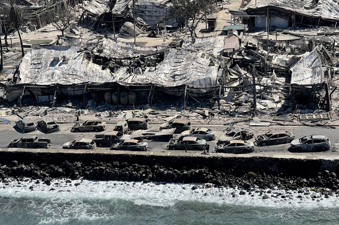 The shells of burned houses, vehicles and buildings are left on Friday, August 11, after wildfires driven by high winds burned across most of Lahaina, Hawaii. 