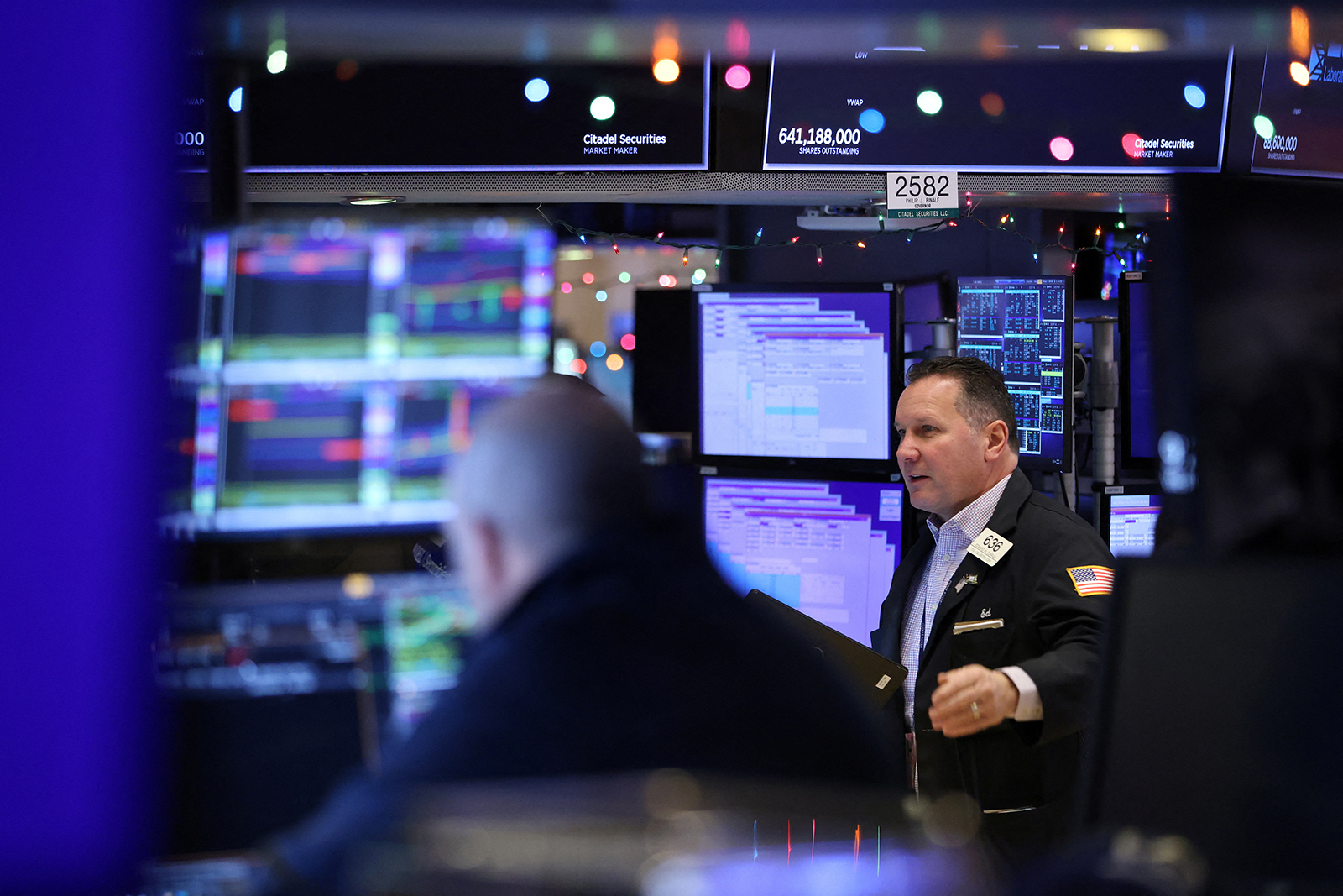Traders work on the trading floor at the New York Stock Exchange on December 14.