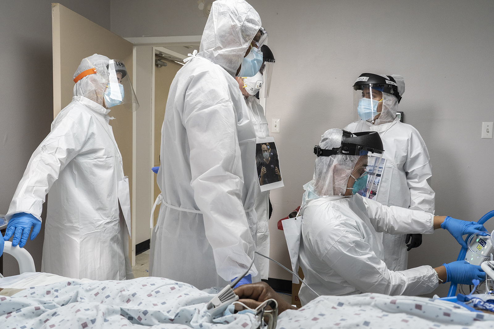 Doctors and nurses wearing protective gear treat a patient in the Covid-19 intensive care unit at a hospital in Houston, Texas on June 29.