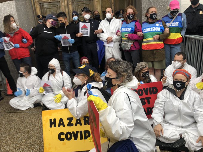 Demand Justice demonstrators gather outside the Capitol on Monday morning.