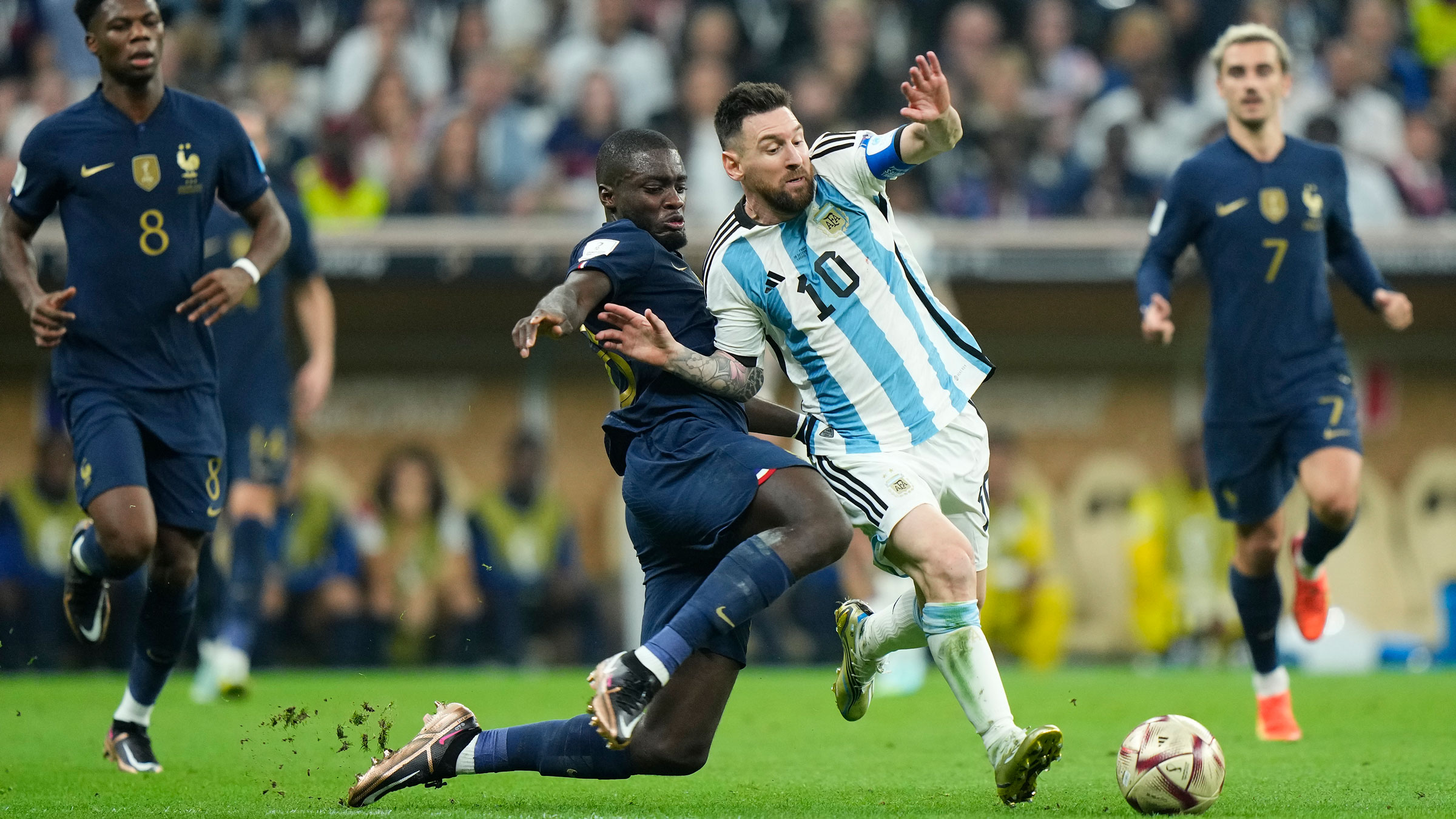 Lionel Messi holds off Dayot Upamecano.