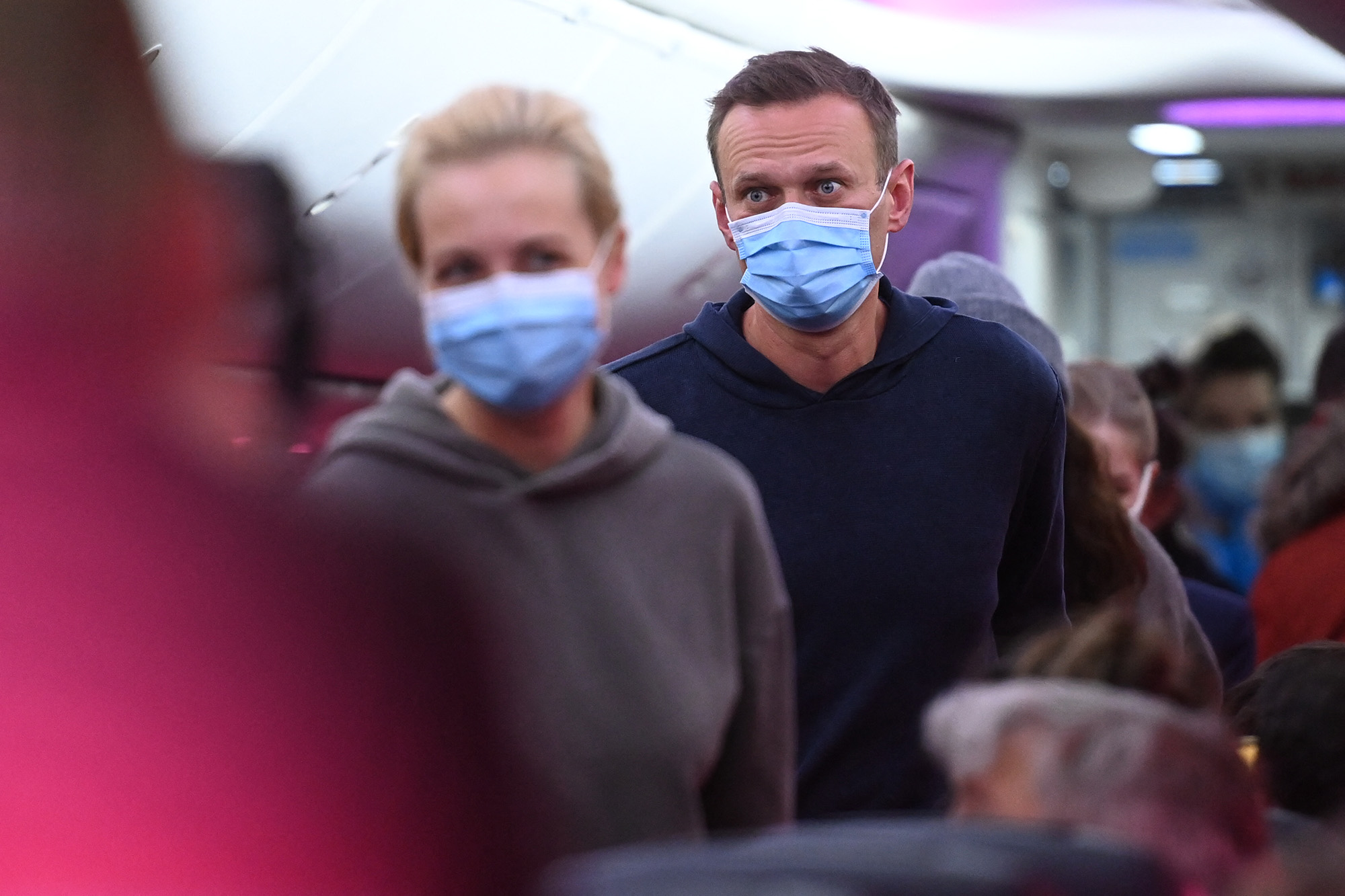 Russian opposition leader Alexey Navalny and his wife Yulia are seen in a Pobeda plane heading from Berlin to Moscow on January 17, 2021. 