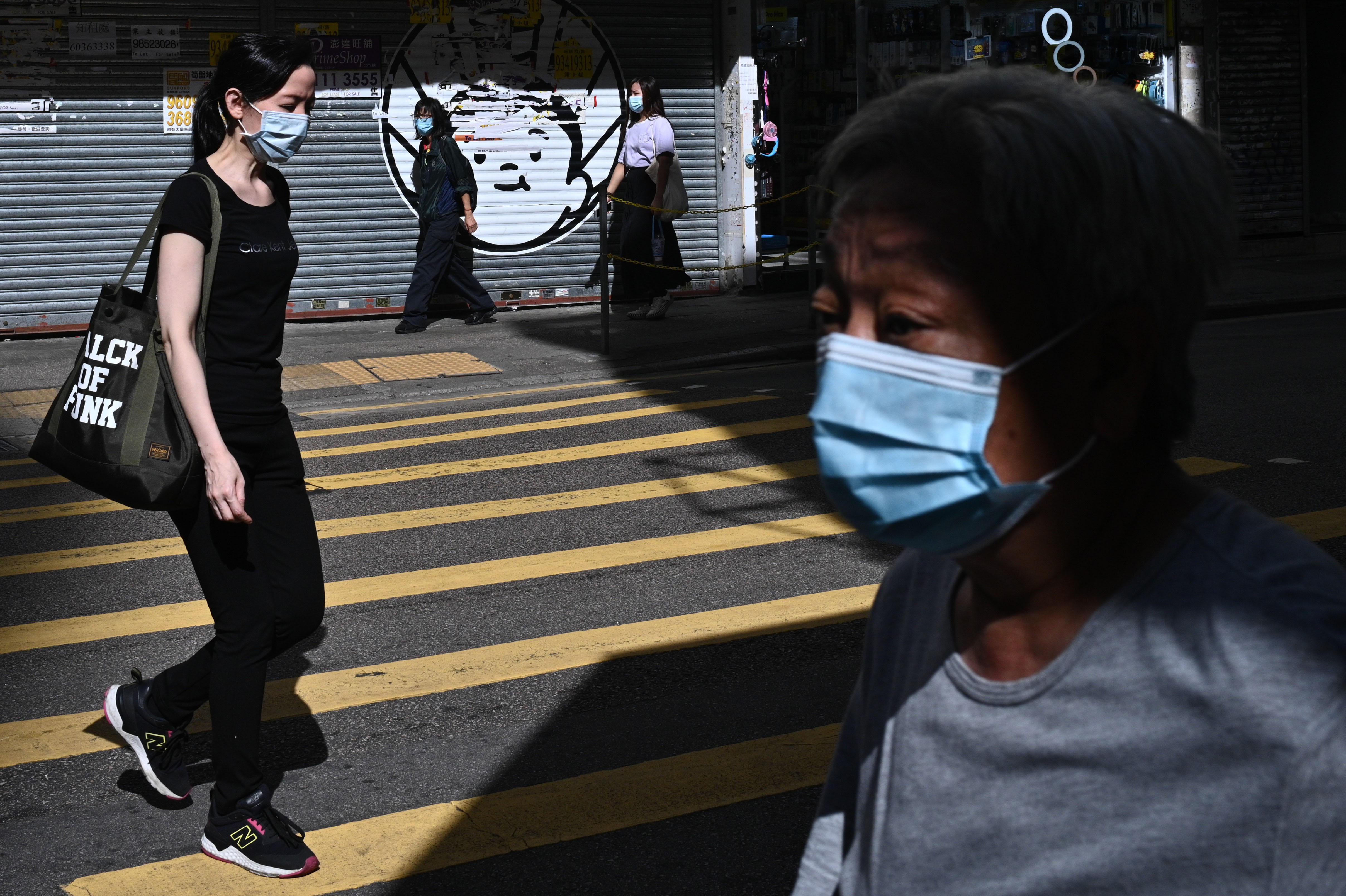 People walk in Hong Kong on July 27.