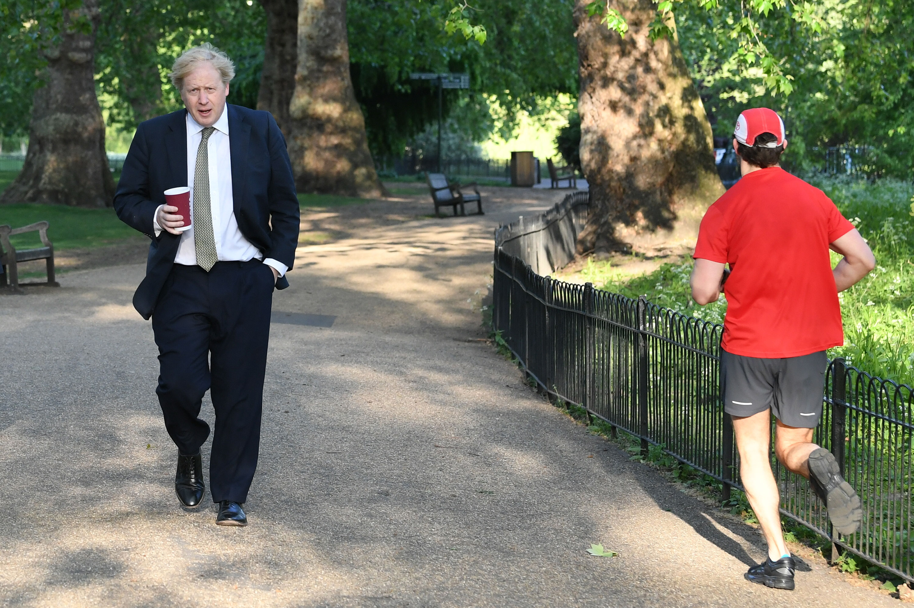 Prime Minister Boris Johnson takes a morning walk in St. James's Park in London before returning to Downing Street on May 6.