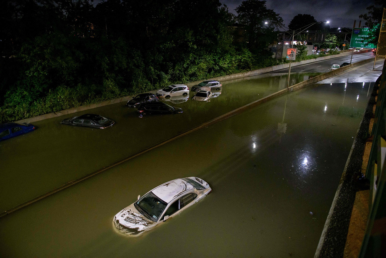 Cars are abandoned on a flooded expressway in Brooklyn, New York, on September 2.