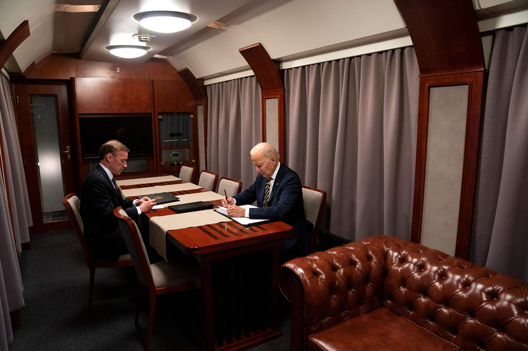 US President Joe Biden sits on a train with National Security Advisor Jake Sullivan after a surprise visit with Ukrainian President Volodymyr Zelensky, in Kyiv, Ukraine, on February 20.