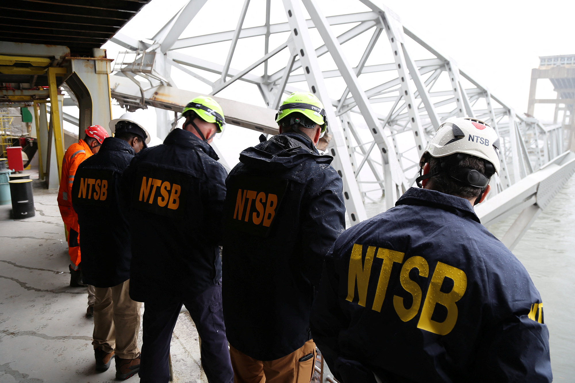 National Transportation Safety Board investigators work on the Dali cargo vessel in Baltimore, Maryland, on March 27, in this NTSB handout photo. 