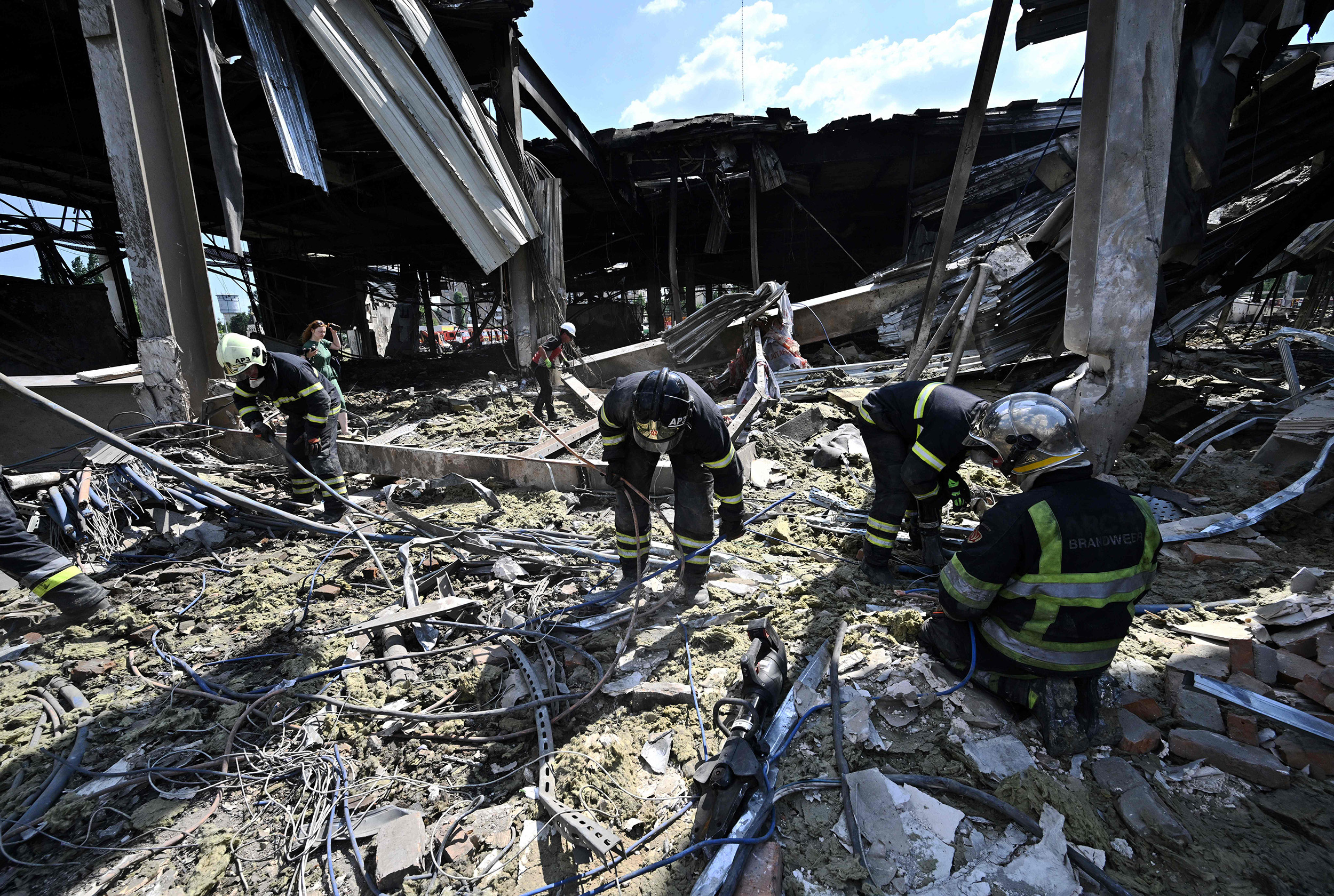 Rescuers clear rubble at the Amstor mall in Kremenchuk, Ukraine, on June 28.