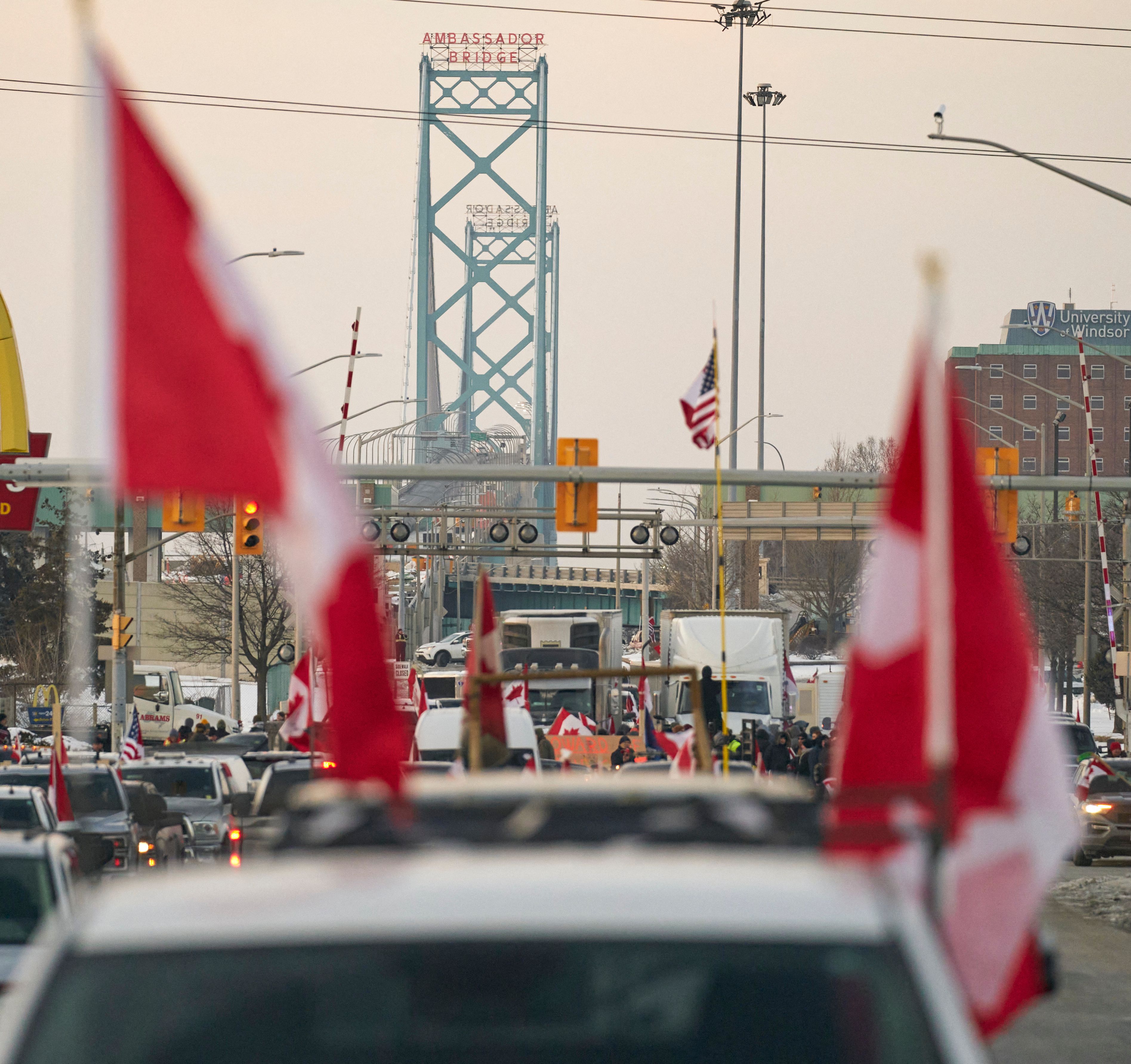 Supporters of the truckers protesting against the Covid-19 vaccine mandate, block traffic in the Canada bound lanes of the Ambassador Bridge border crossing, in Windsor, Ontario, in Canada on Tuesday. 