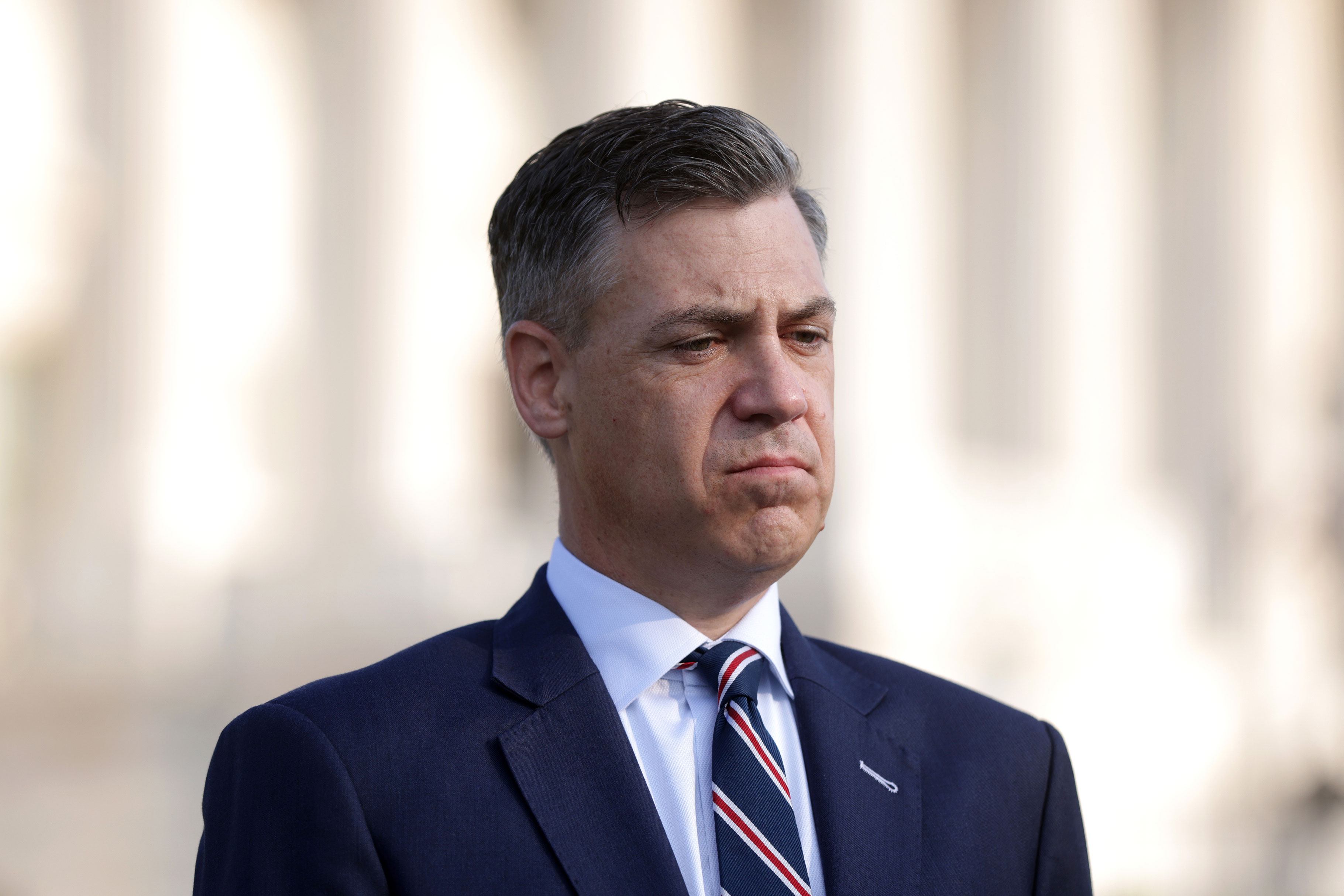 Rep. Jim Banks listens during a news conference in front of the U.S. Capitol on Tuesday, July 27.