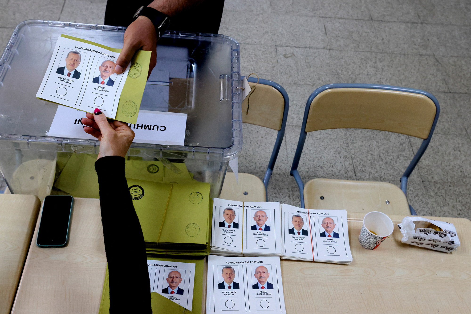 People hold a ballot at a polling station in Ankara, Turkey, on May 28. 